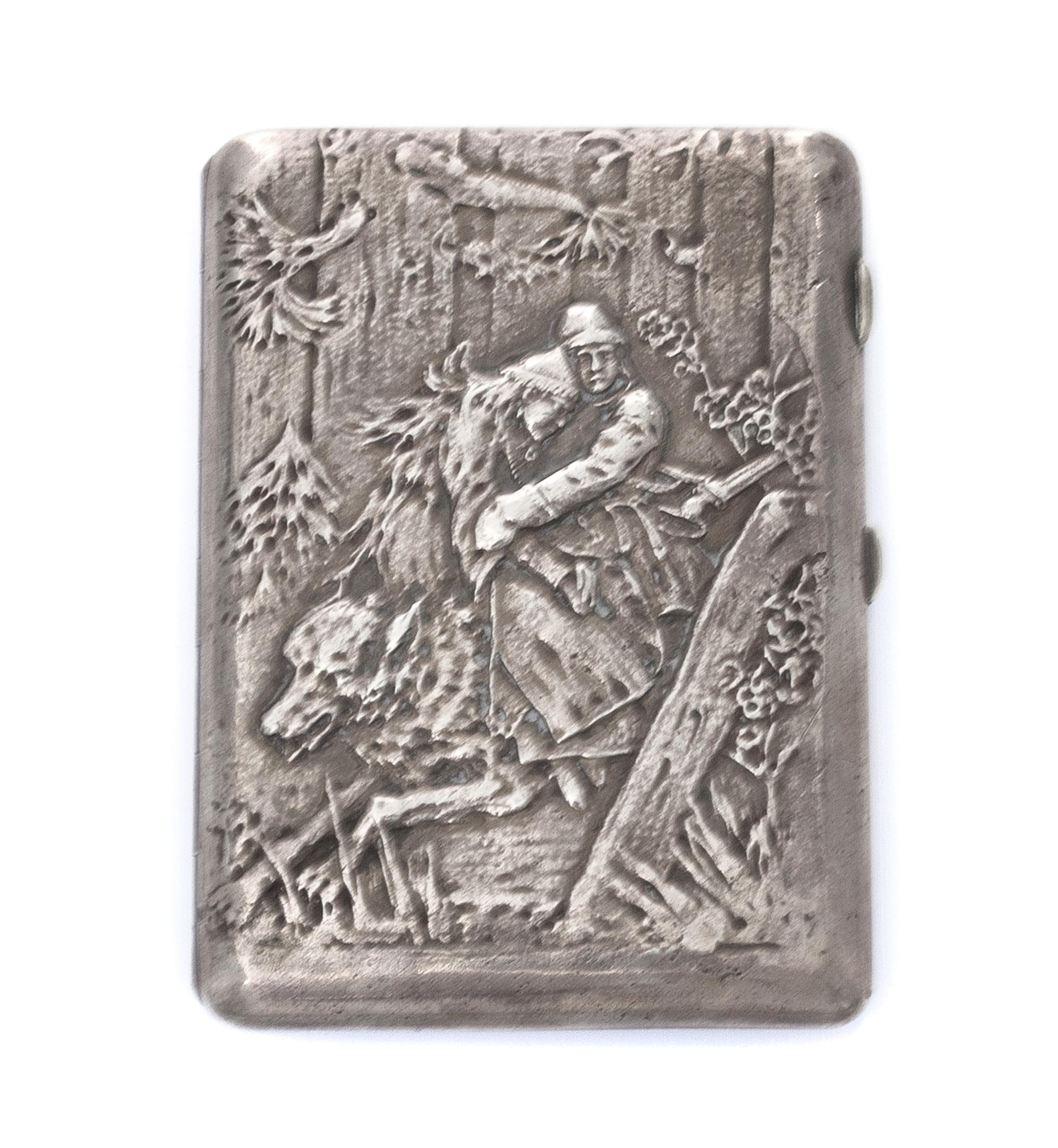 A Ukrainian Silver Cigarette Case, Maker's mark Cyrillic 4YuK, Kiev, of rectangular form, the lid worked to show a man and woman riding