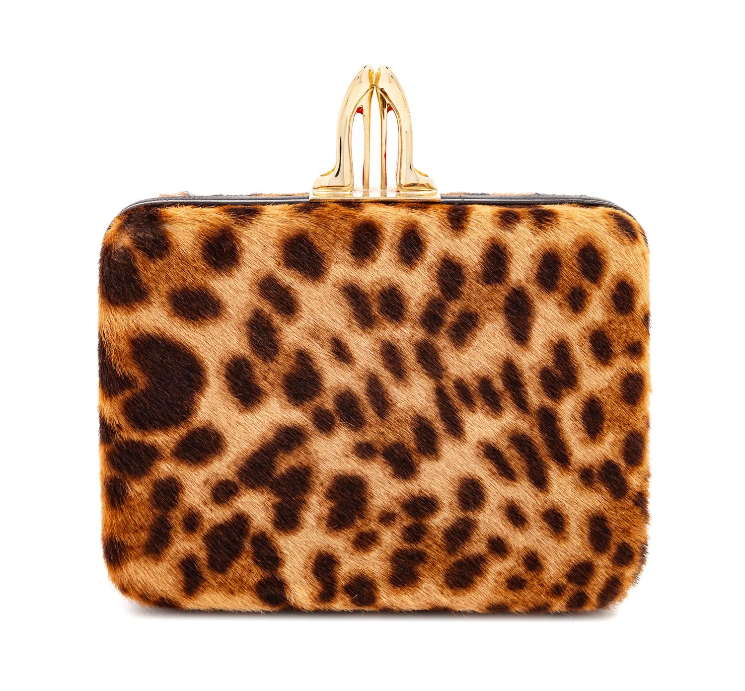 A Christian Louboutin Leopard Print Pony Hair Clutch, 4" H x 5.5" W x 1.5" D.