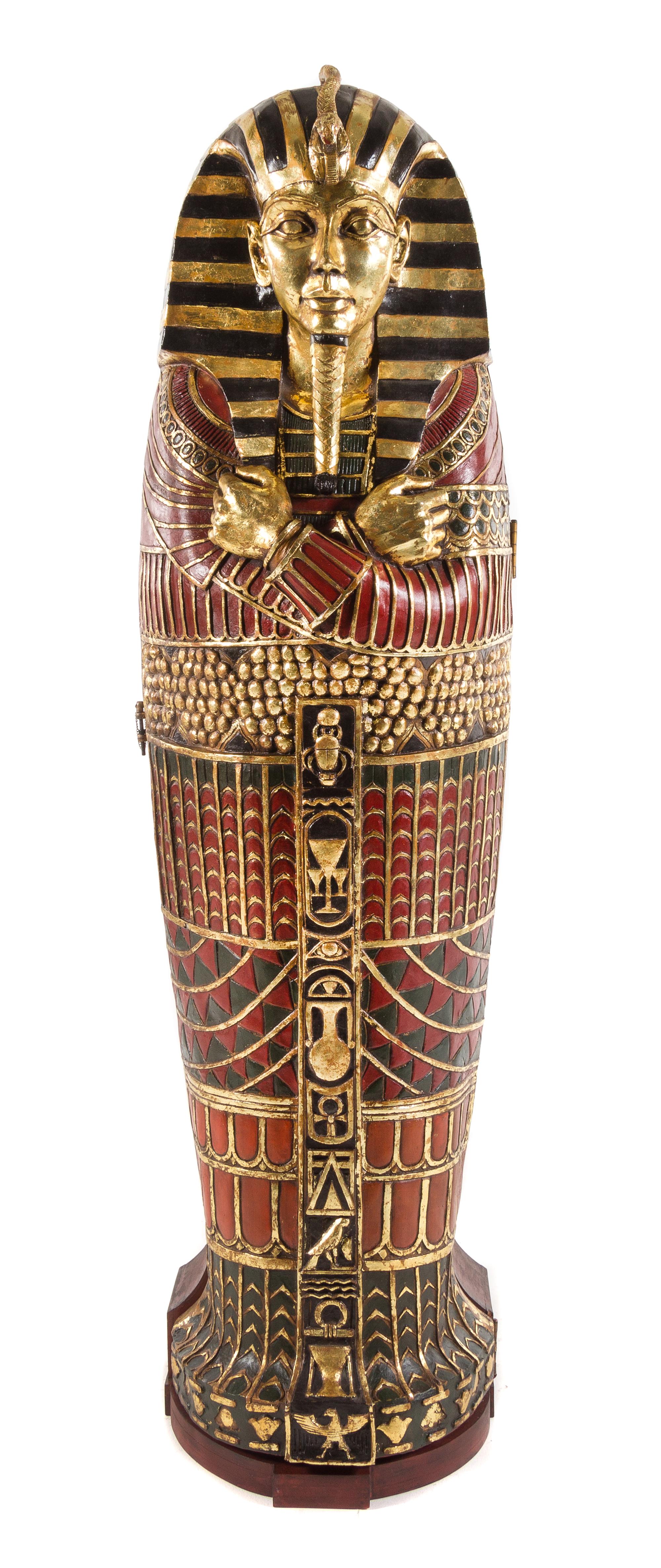 An Egyptian Style Painted Composition Sarcophagus Cabinet Height 74 1/2 inches. — 20TH CENTURY