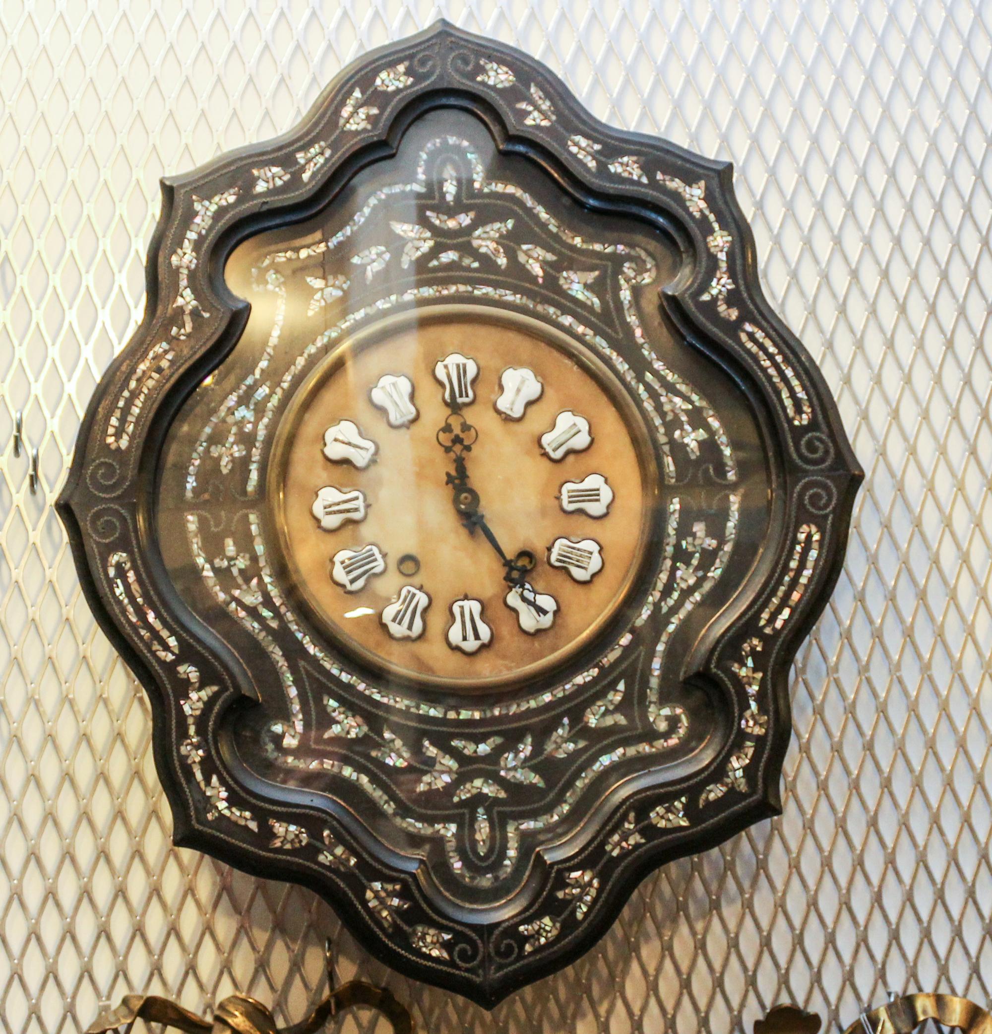 A Victorian Ebonized and Mother-of-Pearl Inlaid Wall Clock Height 26 inches. — 19TH CENTURY