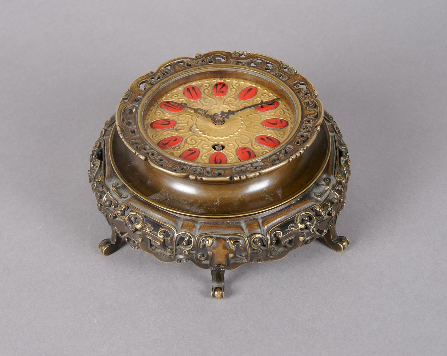 An Austrian Bronze Table Clock, Height overall 2 1/2 inches.