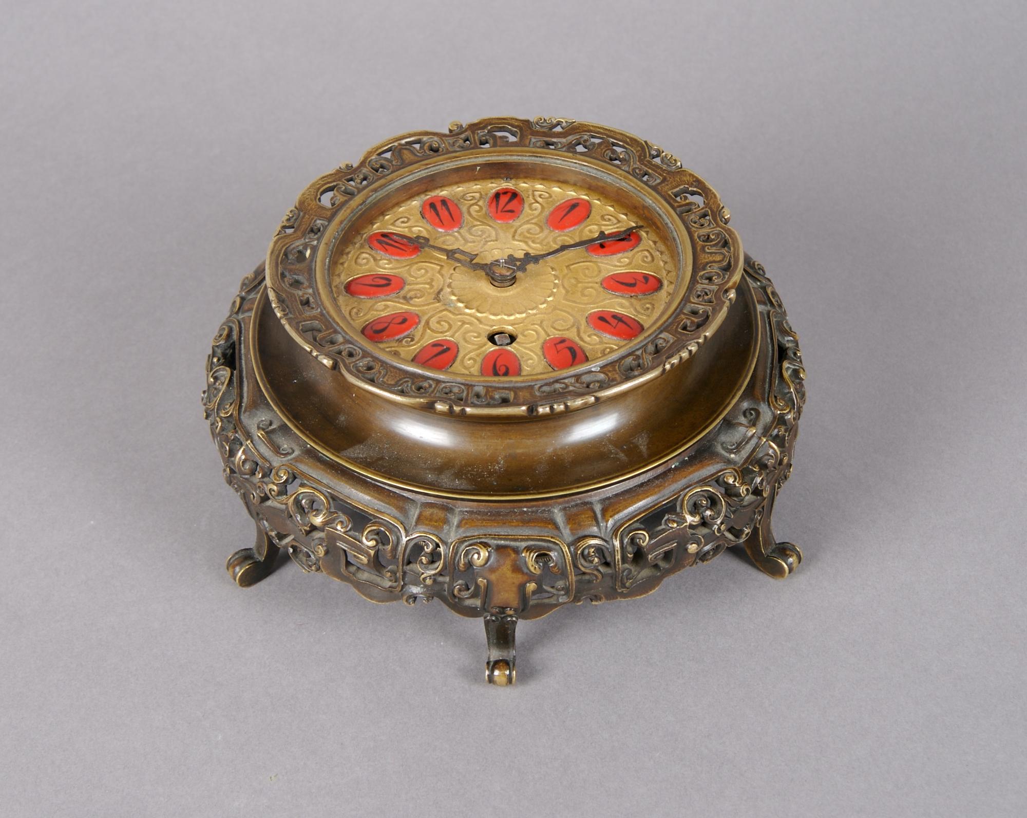 An Austrian Bronze Table Clock, Height overall 2 1/2 inches.