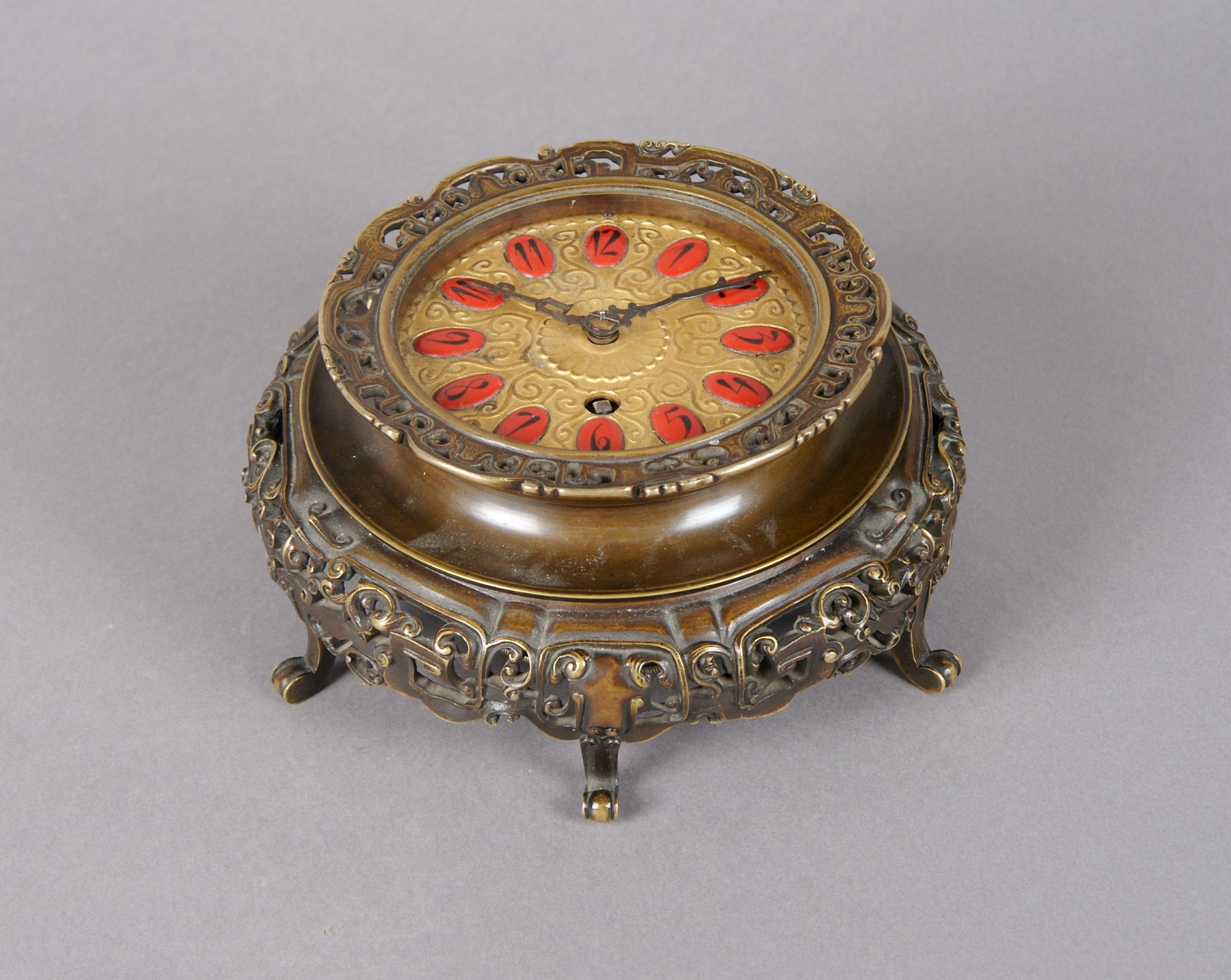 An Austrian Bronze Table Clock, Height overall 2 1/2 inches.