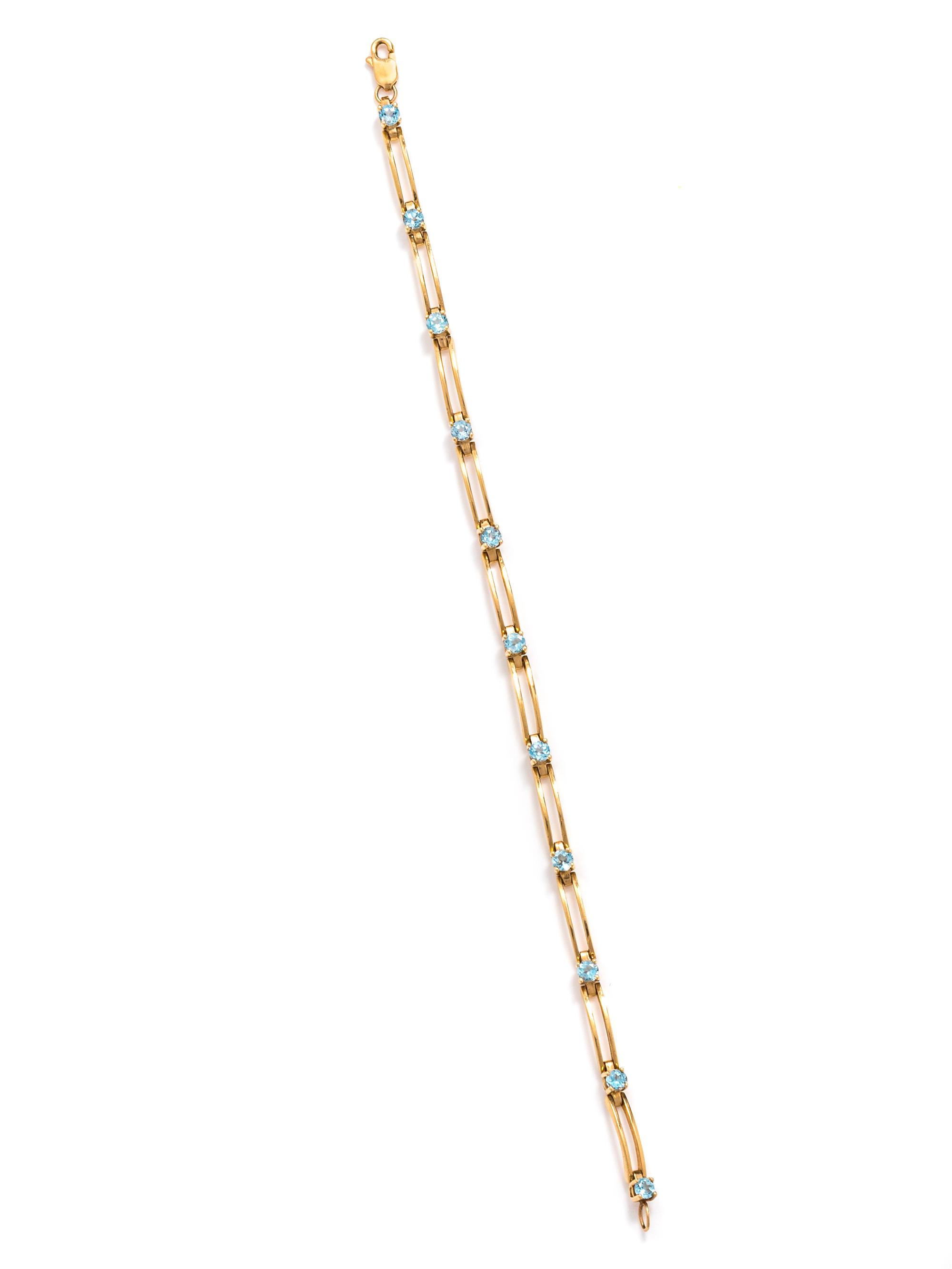 YELLOW GOLD AND BLUE TOPAZ BRACELET