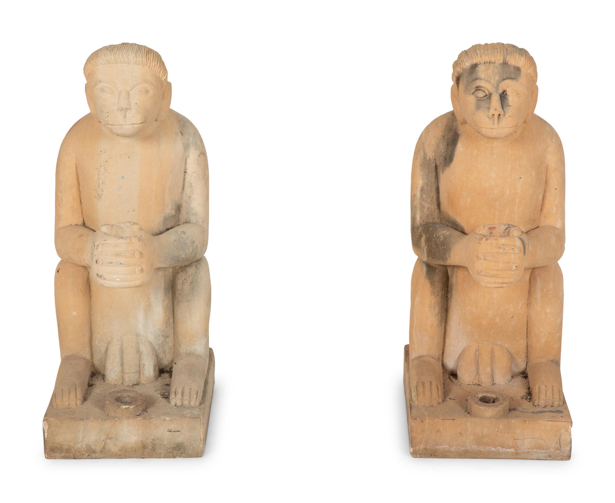 A Pair of Cast Stone Monkey-Form Torchere Holders