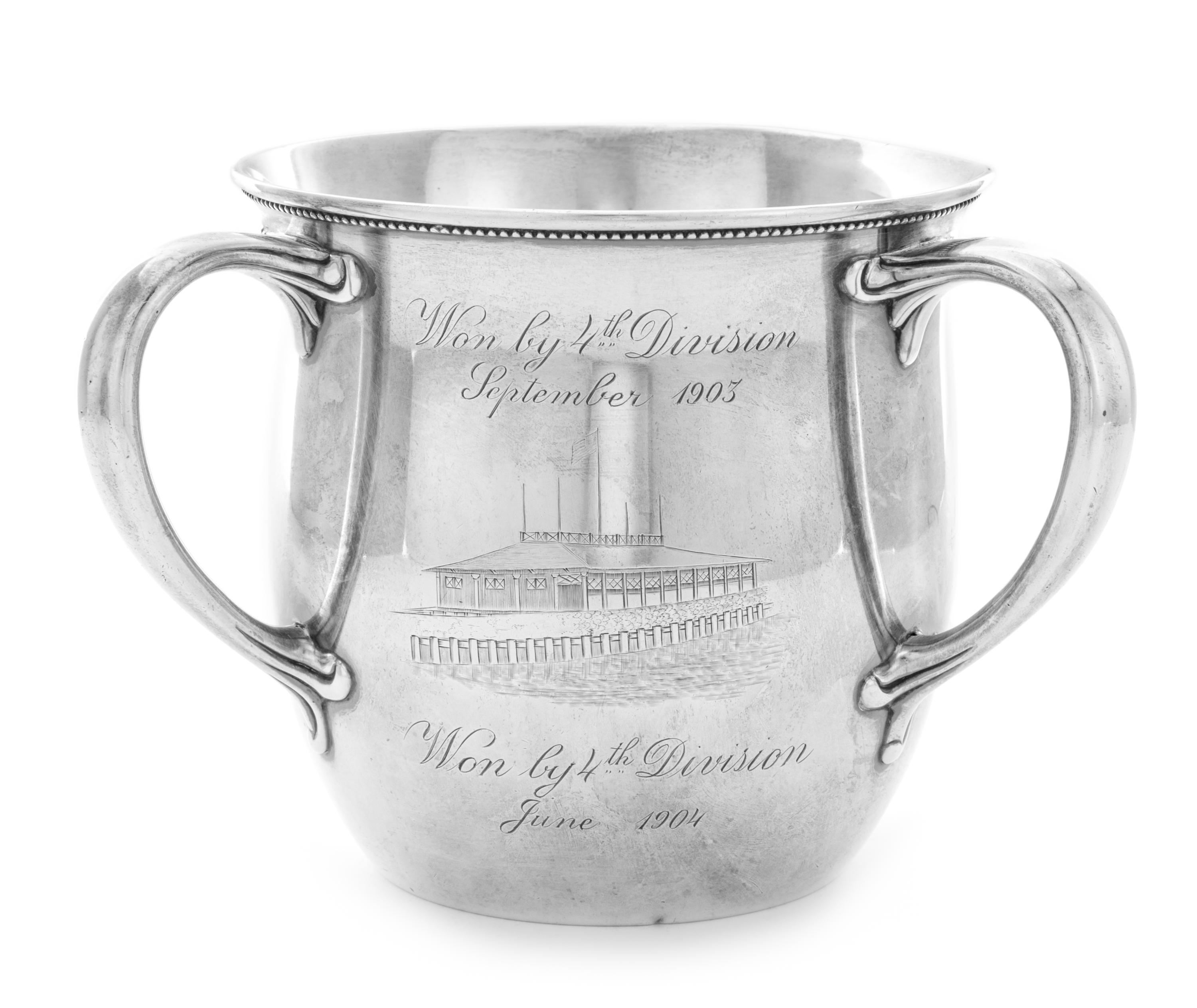 An American Silver Trophy Cup of Rowing Interest, Gorham Mfg. Co., Providence, RI, 1897, of Tyg form, the body engraved with a scene of