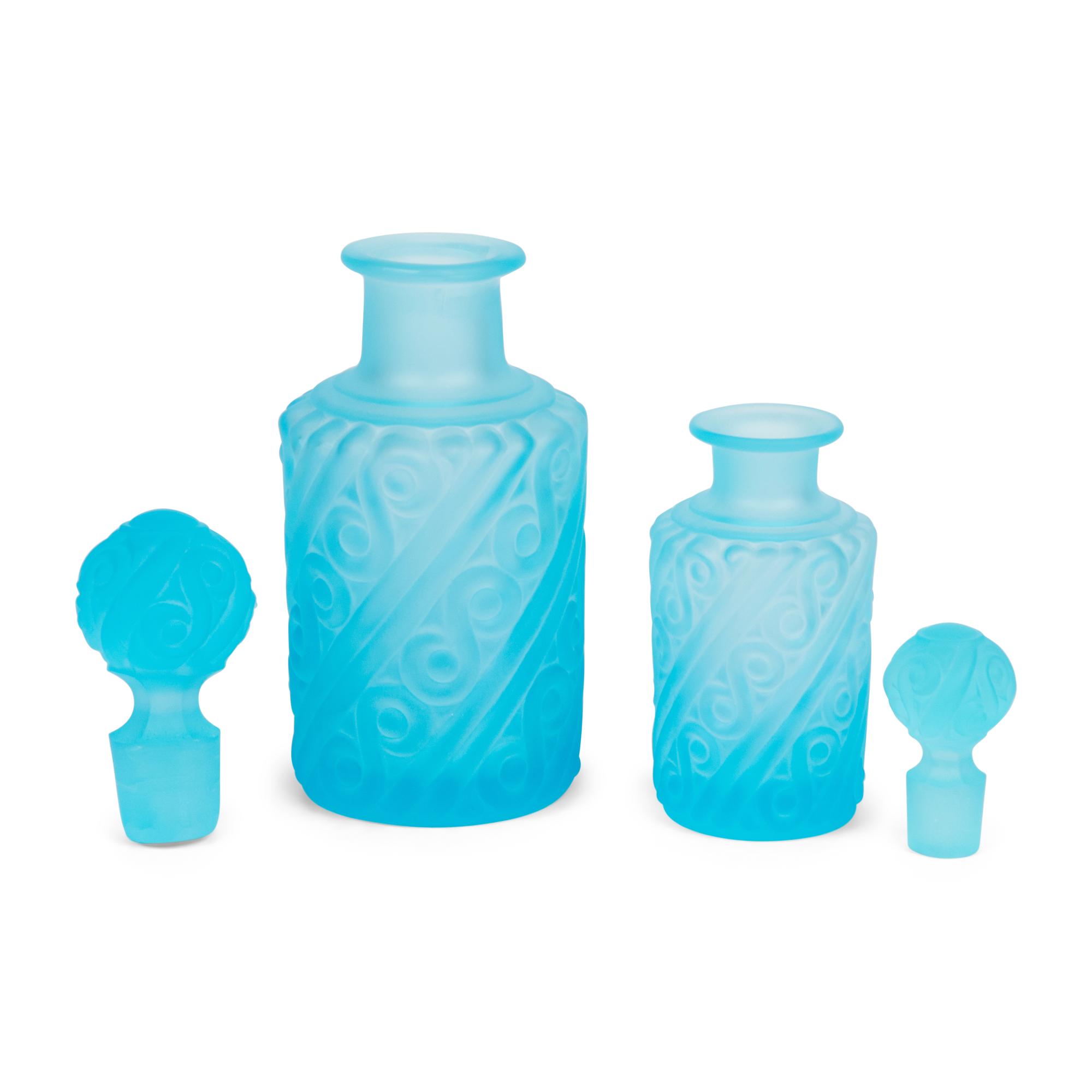A Collection of Colored Glass and Ceramic Vases and Bottles