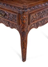 A Louis XV Provincial Style Carved Walnut Desk