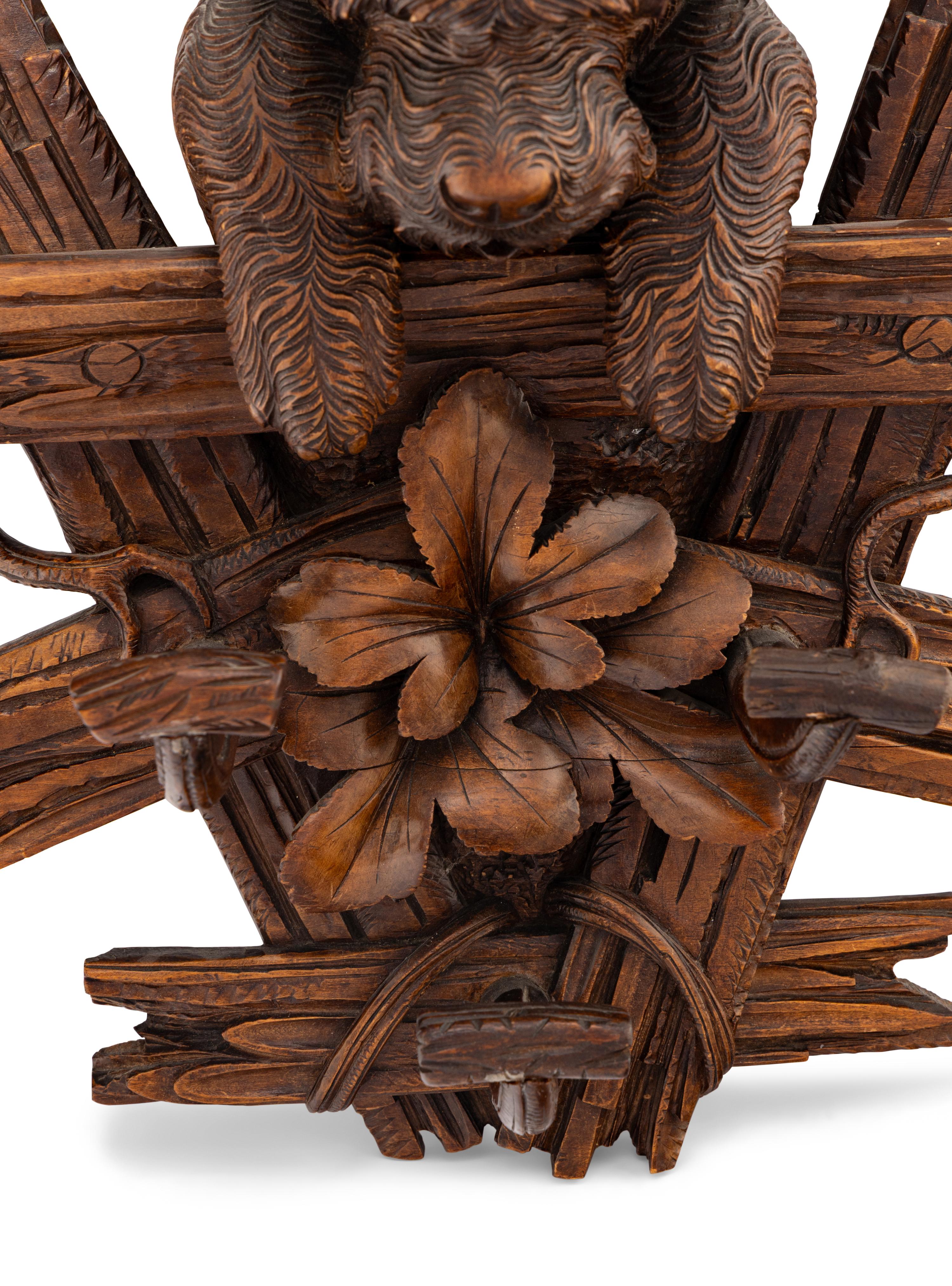 A Swiss "Black Forest" Carved Figural Coat Hook