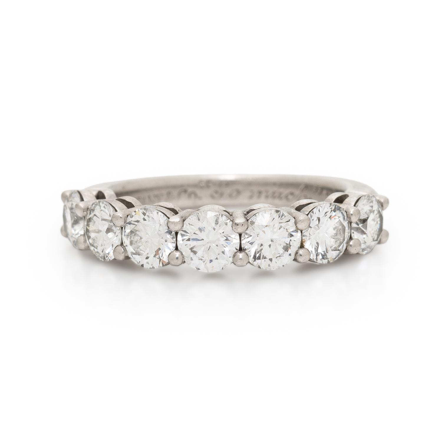 TIFFANY & CO., SEVEN DIAMOND AND PLATINUM RING