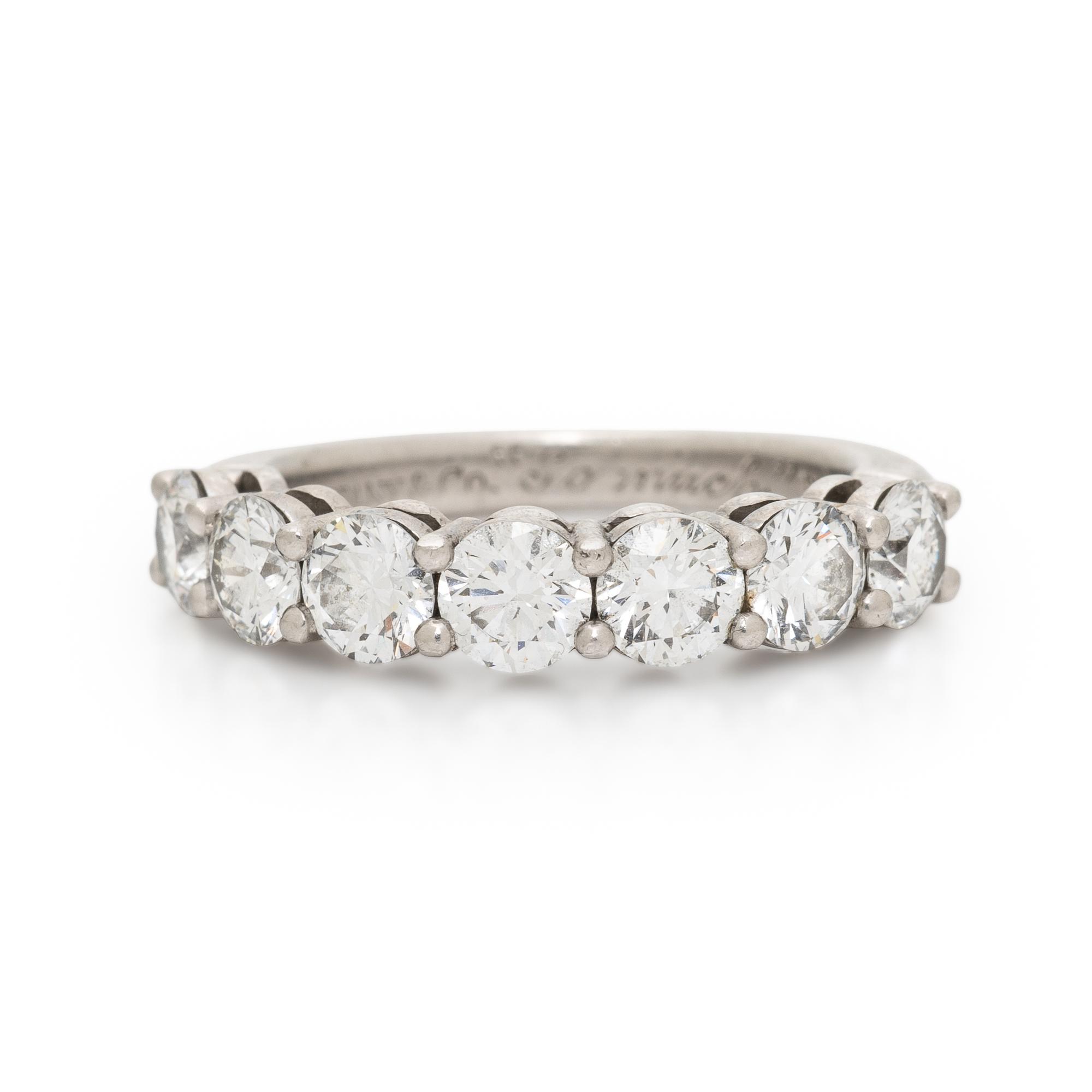 TIFFANY & CO., SEVEN DIAMOND AND PLATINUM RING