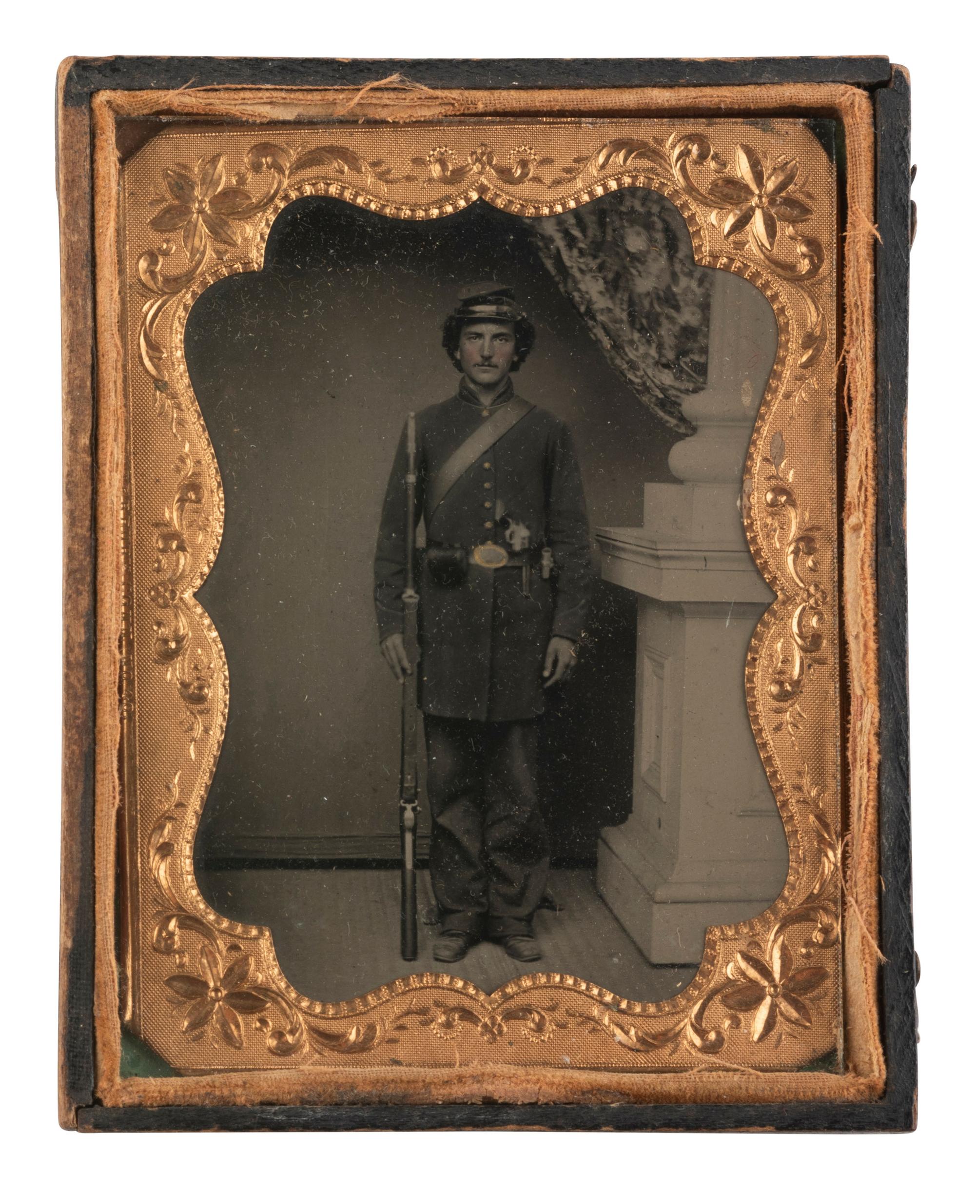 [CIVIL WAR]. Tintype portrait of a doubly armed soldier in full kit.