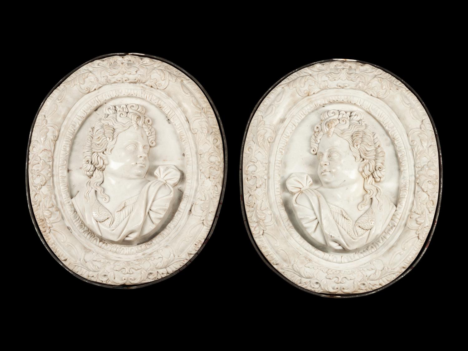 A Pair of Iron Mounted Marble Plaques