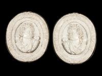 A Pair of Iron Mounted Marble Plaques