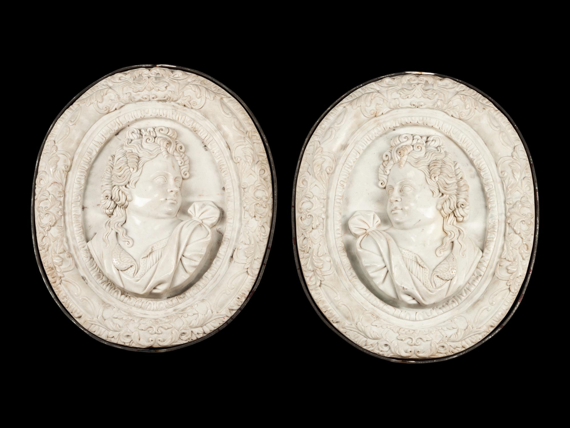 A Pair of Iron Mounted Marble Plaques