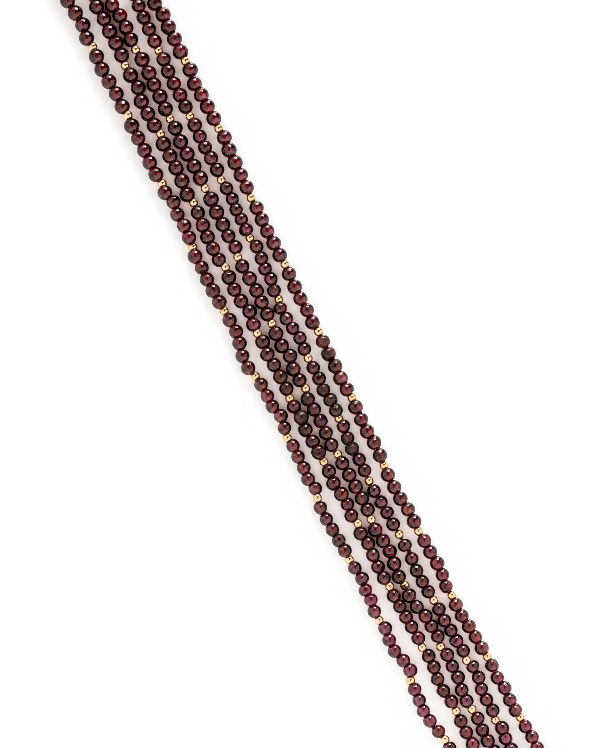 YELLOW GOLD AND MULTISTRAND GARNET BEAD NECKLACE