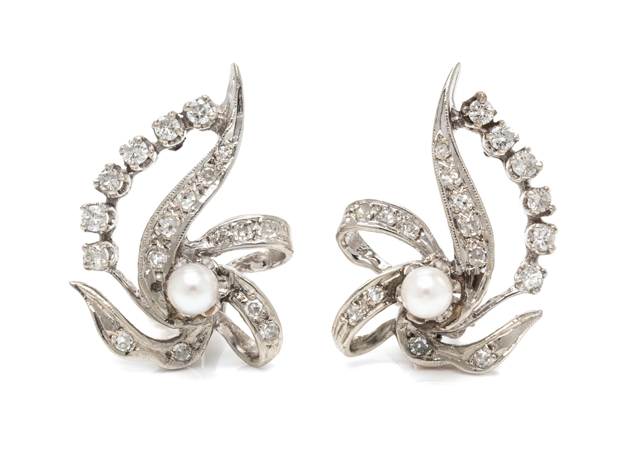 A Pair of 14 Karat White Gold, Cultured Pearl and Diamond Earclips, 4.30 dwts.