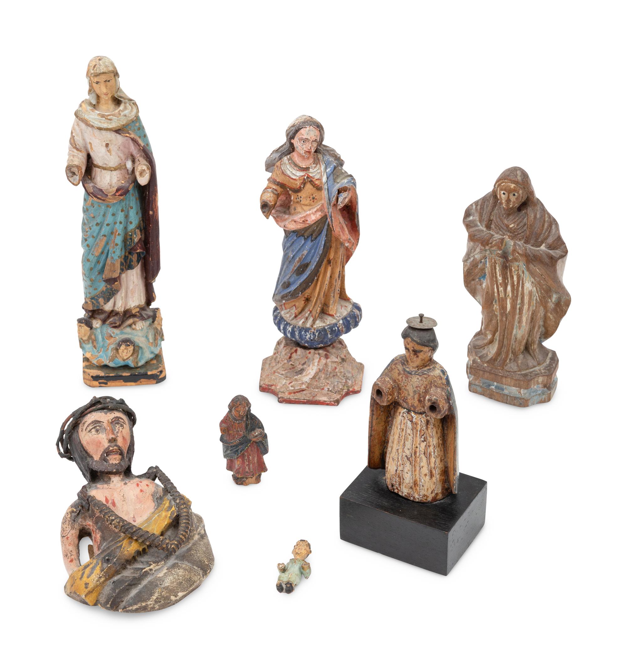 Seven Continental Carved and Polychromed Santos Figures
