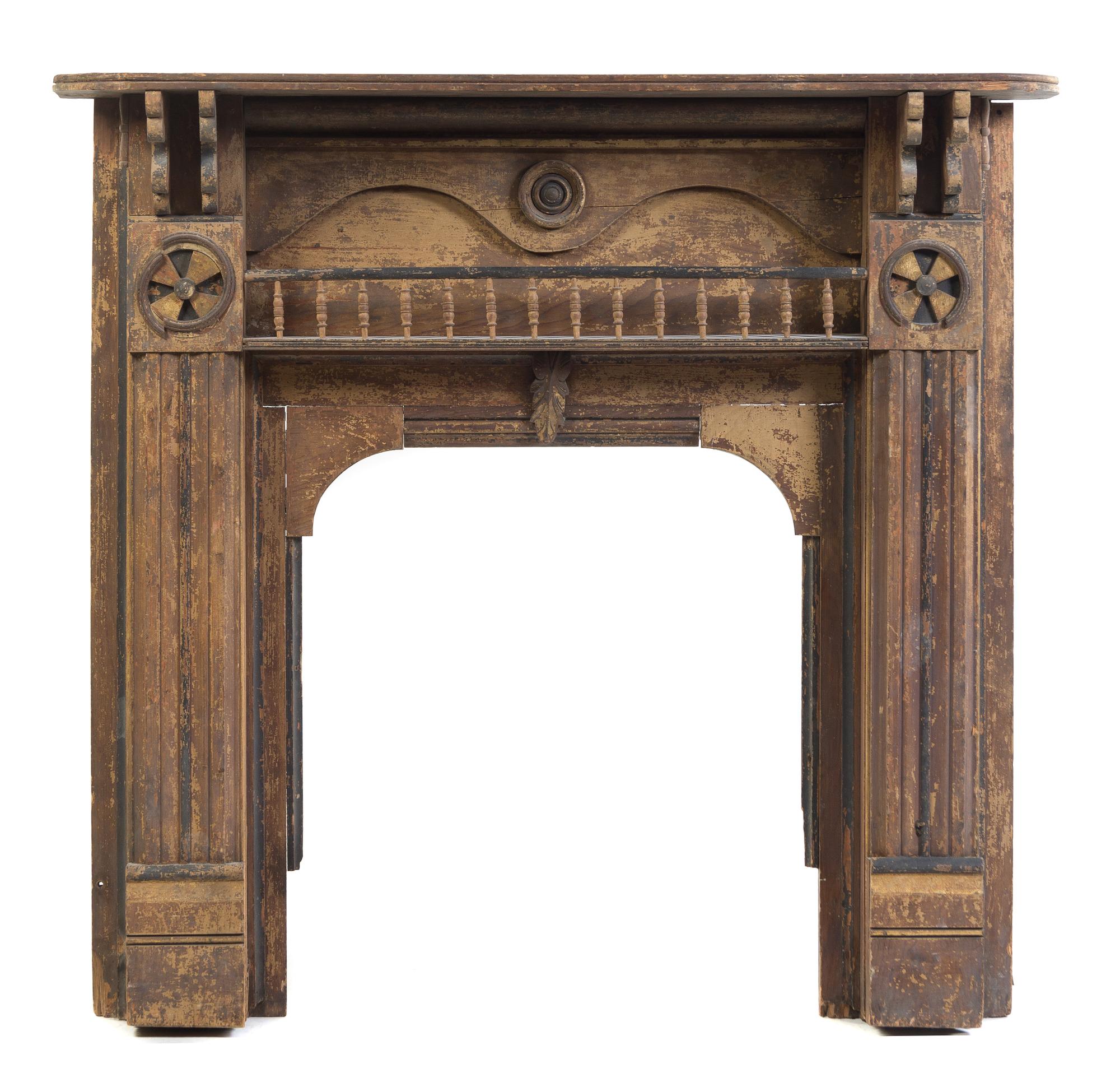An American Parcel Gilt and Ebonized Fireplace Surround Height 48 1/2 x width 41 1/2 x depth 9 inches.