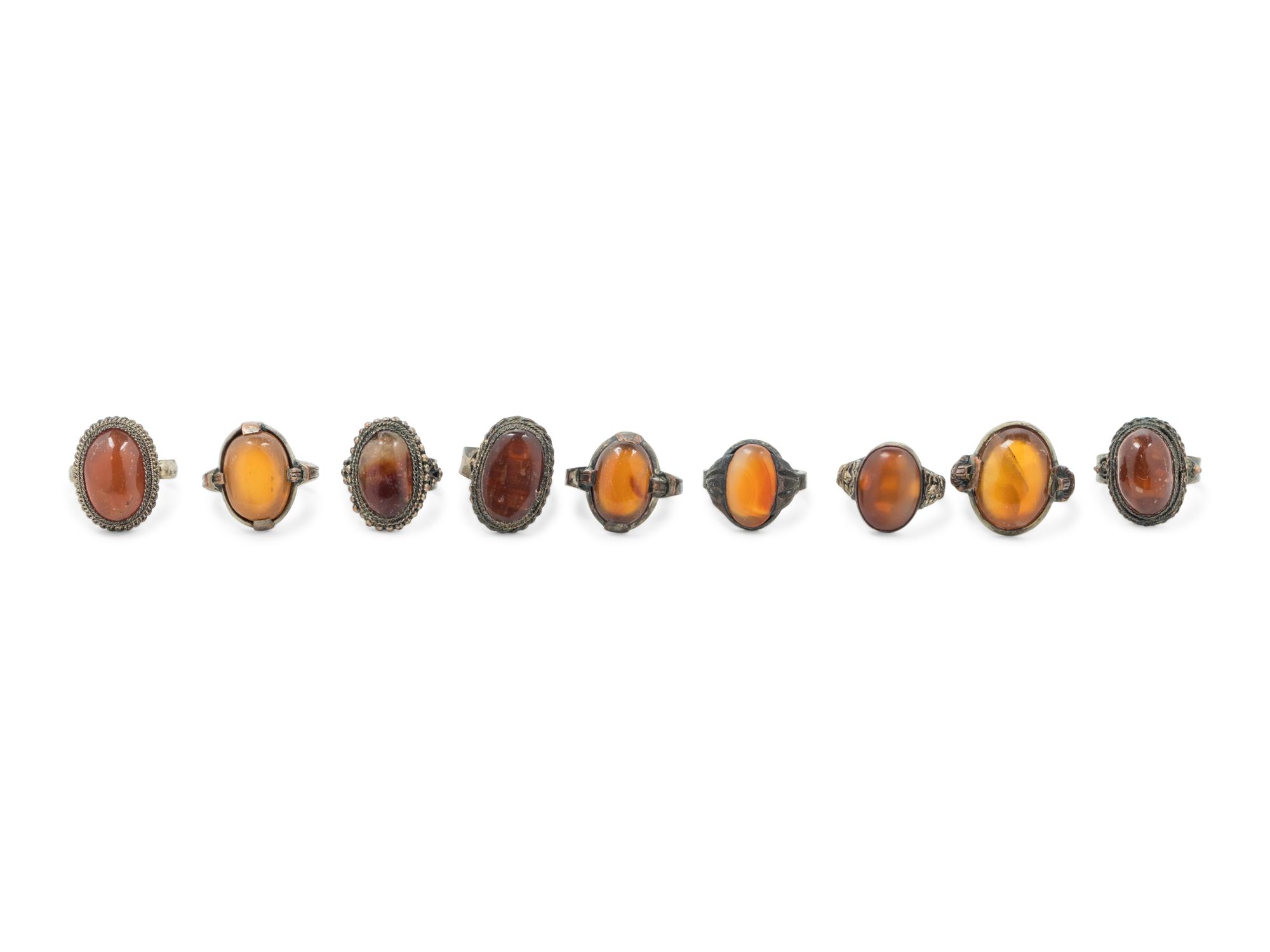 Nine Chinese Carnelian Agate Inset Metal Rings