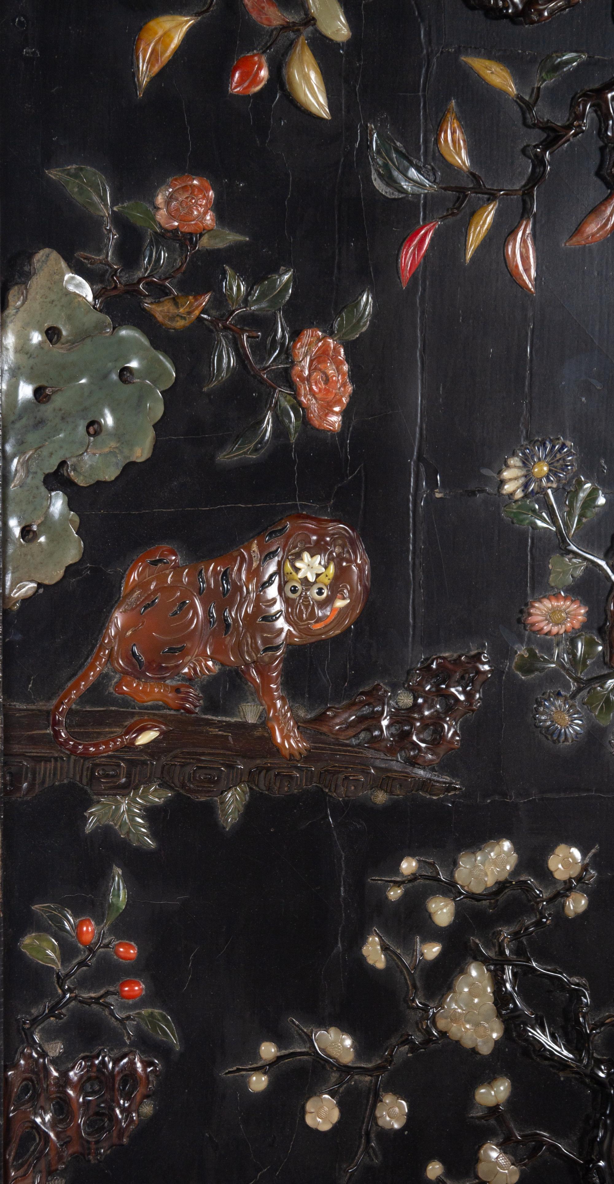 An Embellished and Gilt Decorated Black Lacquered Six-Panel Floor Screen