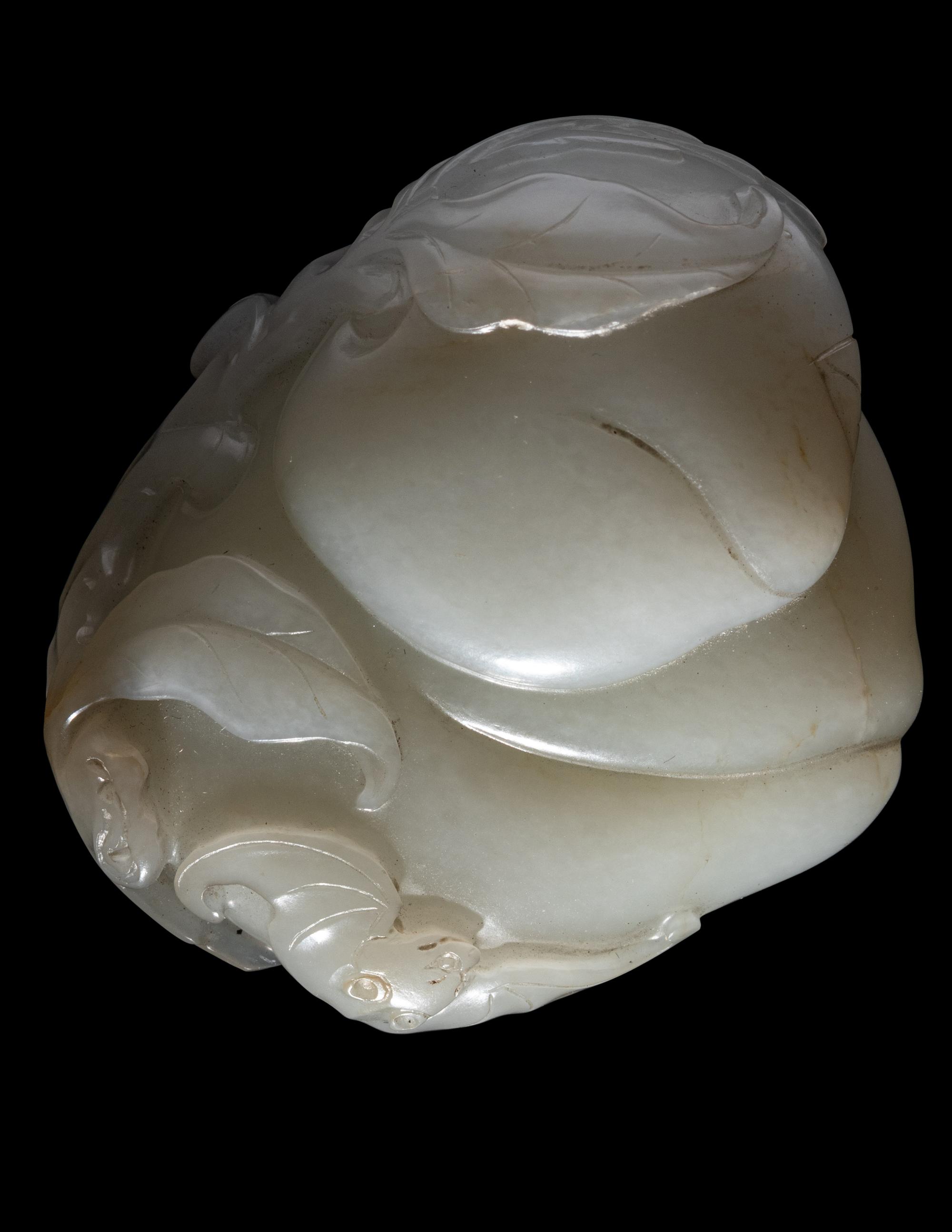 A Carved White Jade 'Peaches and Bat' Group