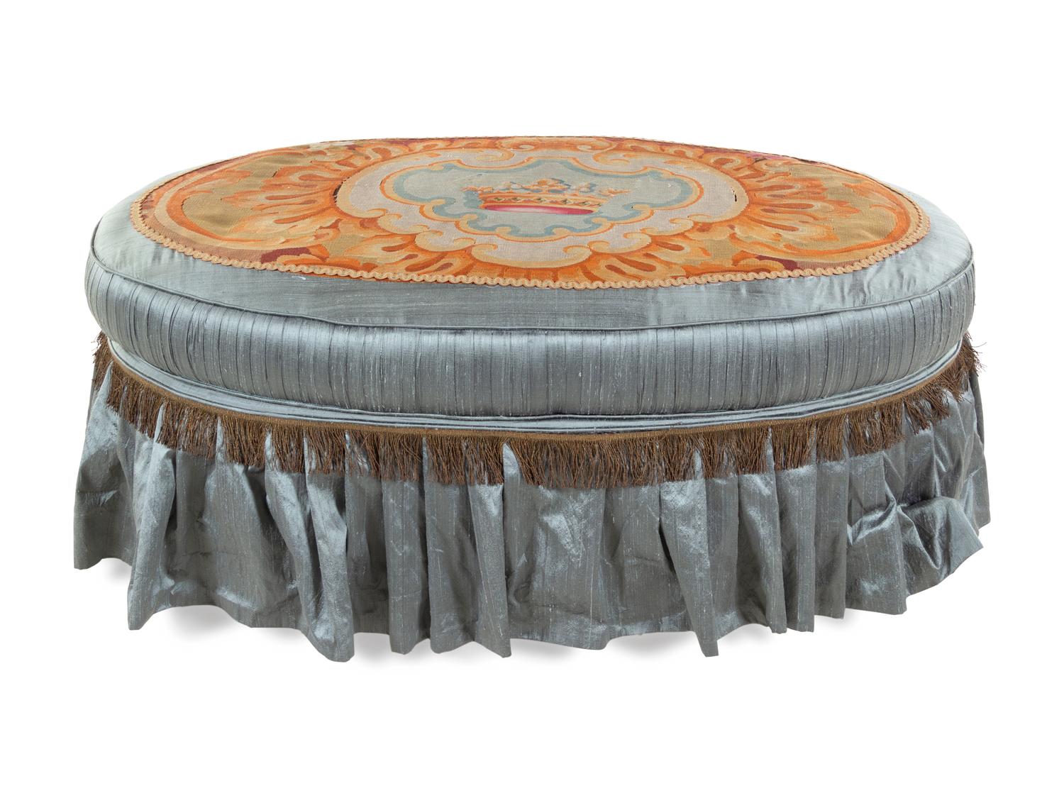 A French Needlepoint Upholstered Ottoman