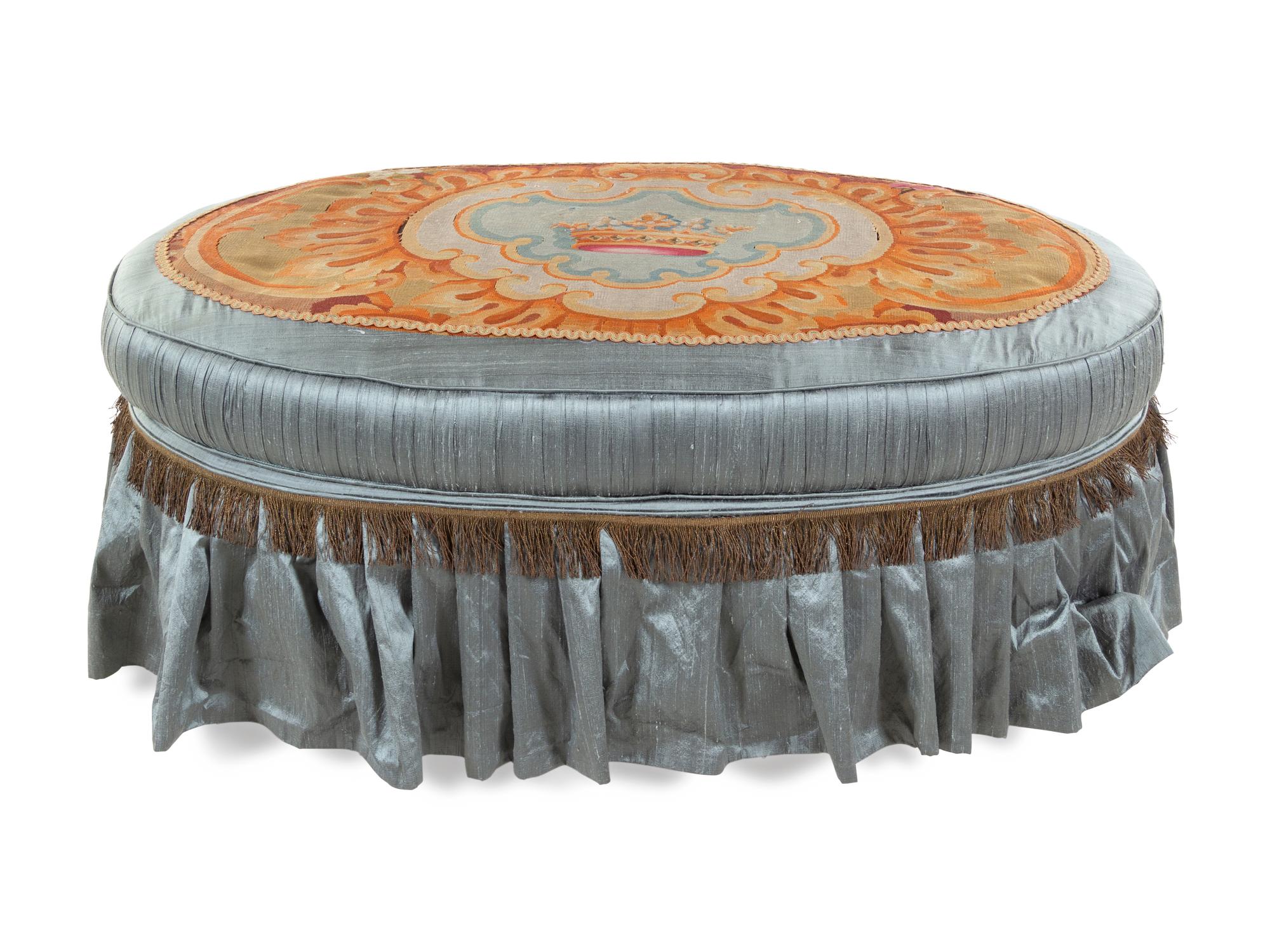 A French Needlepoint Upholstered Ottoman