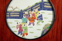 A Set of Four Chinese Famille Rose Porcelain Inset Hardwood Wall Panels