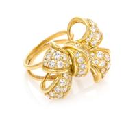 An 18 Karat Yellow Gold and Diamond Bow Motif Ring, Jose Hess, 9.15 dwts.