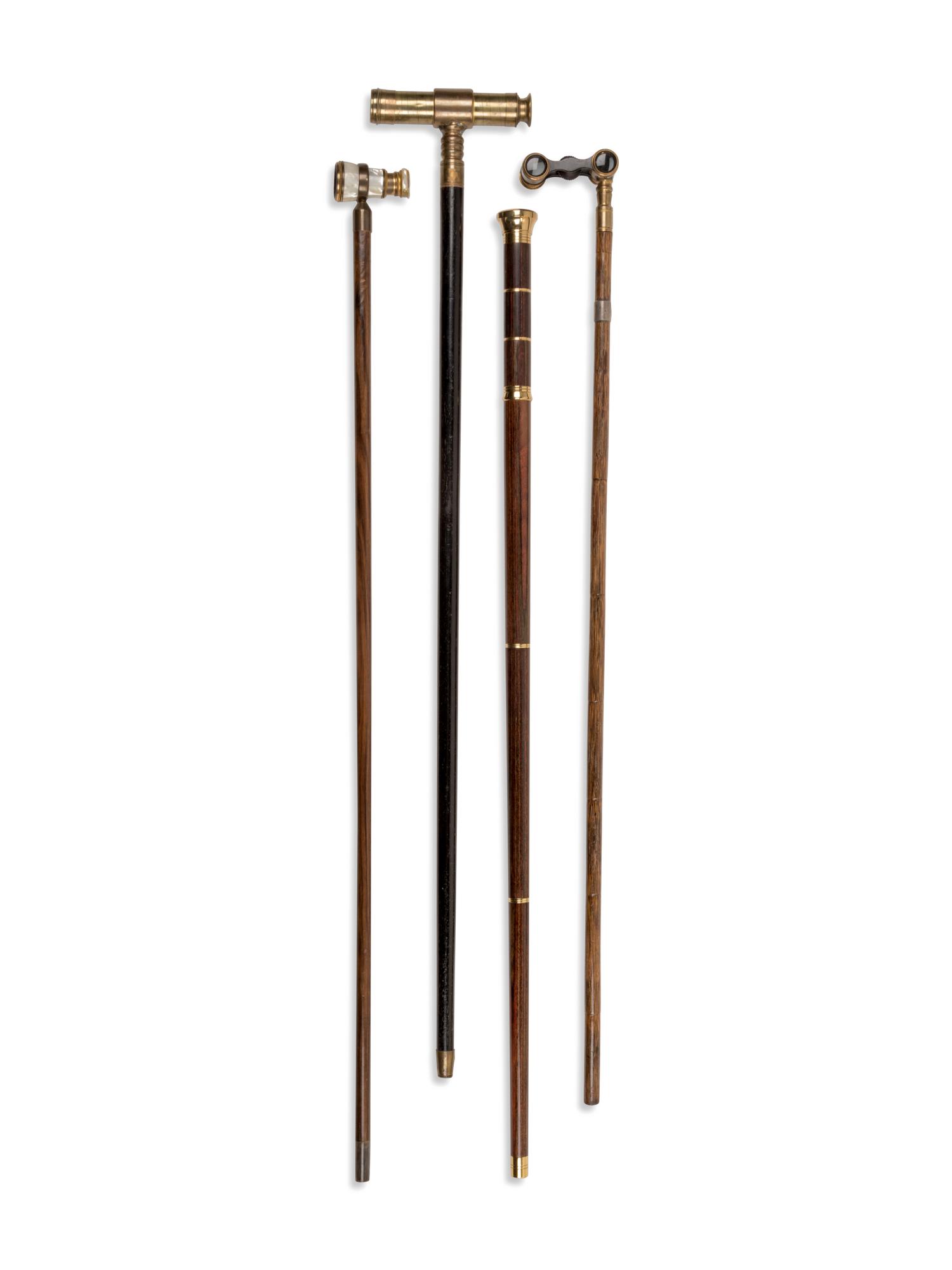 Four Brass-Mounted Optical System Walking Sticks