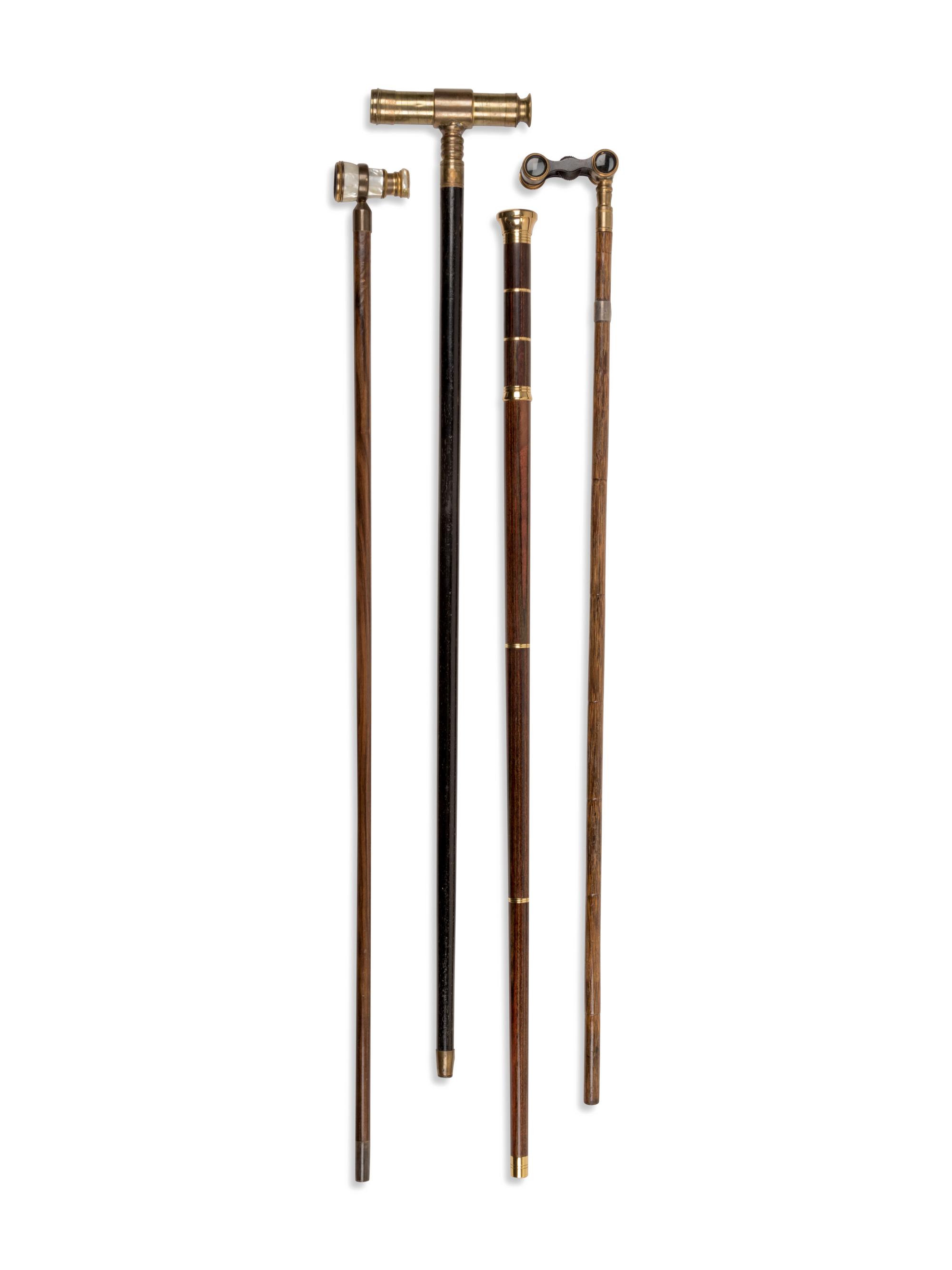 Four Brass-Mounted Optical System Walking Sticks