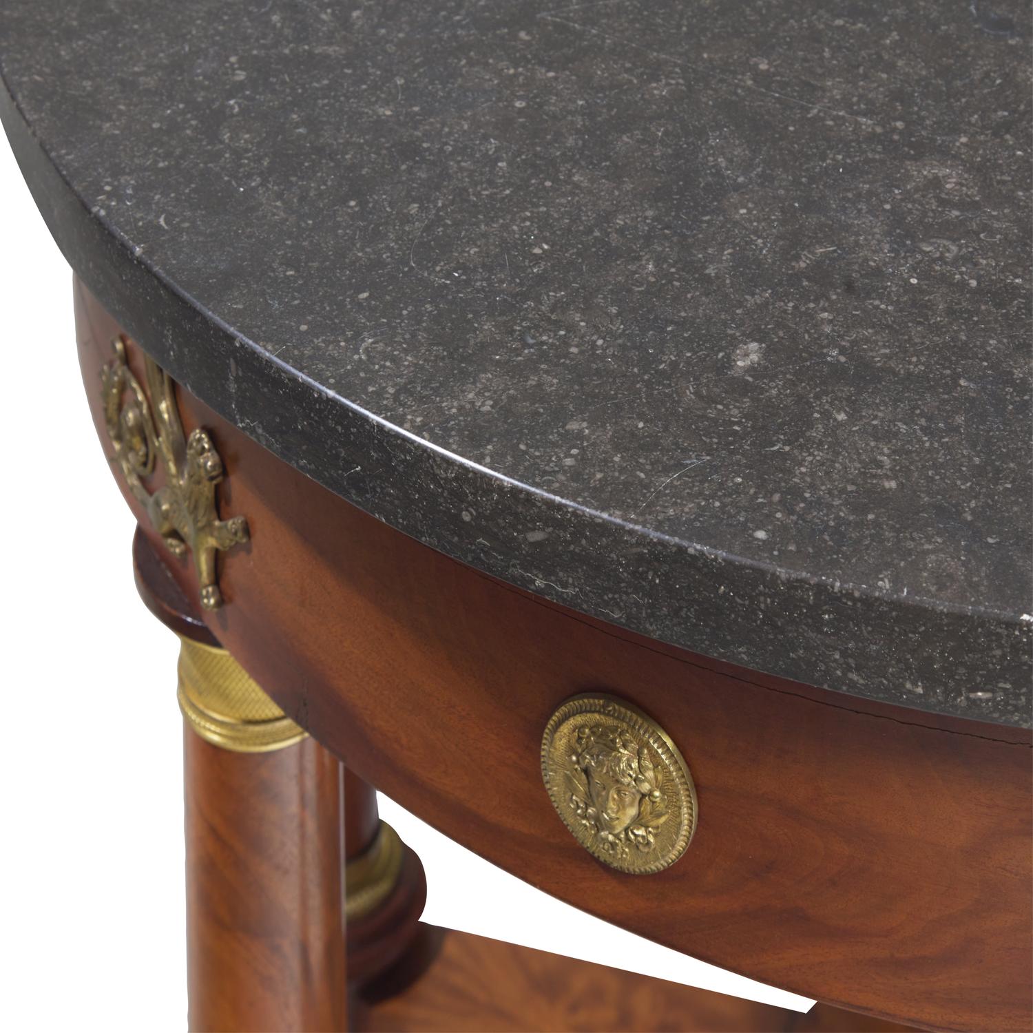 An Empire Flame Mahogany, Gilt-Metal Mounted and Marble-Top Center Table