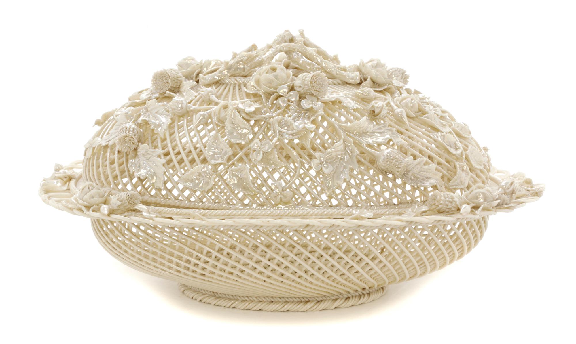 A Belleek Oval Basket and Cover, Width 12 1/4 inches.