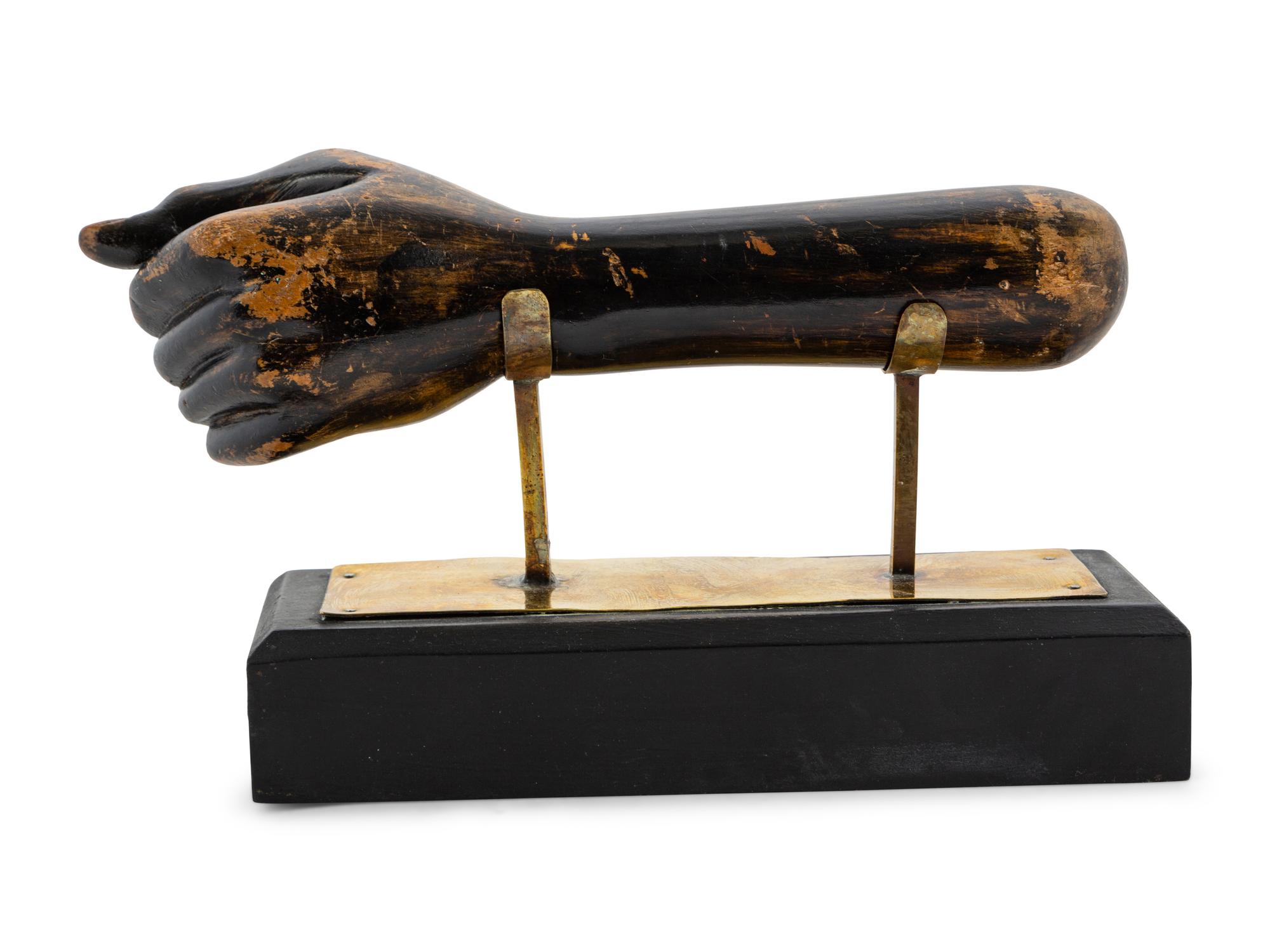 A Carved and Painted Clinched Fist