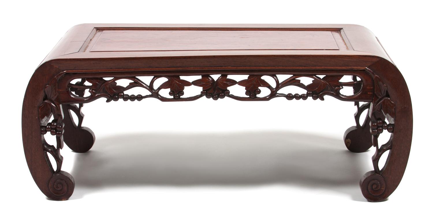 A Chinese Carved Hardwood Low Table Height 10 1/2 x width 29 x depth 14 3/4 inches.
