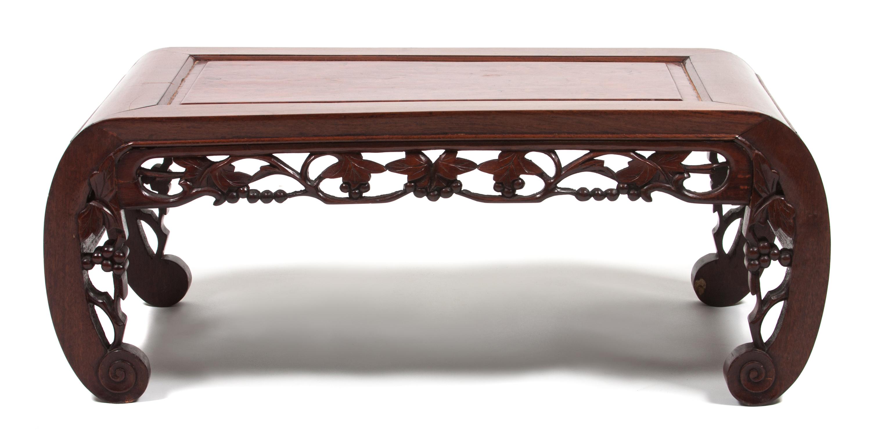 A Chinese Carved Hardwood Low Table Height 10 1/2 x width 29 x depth 14 3/4 inches.