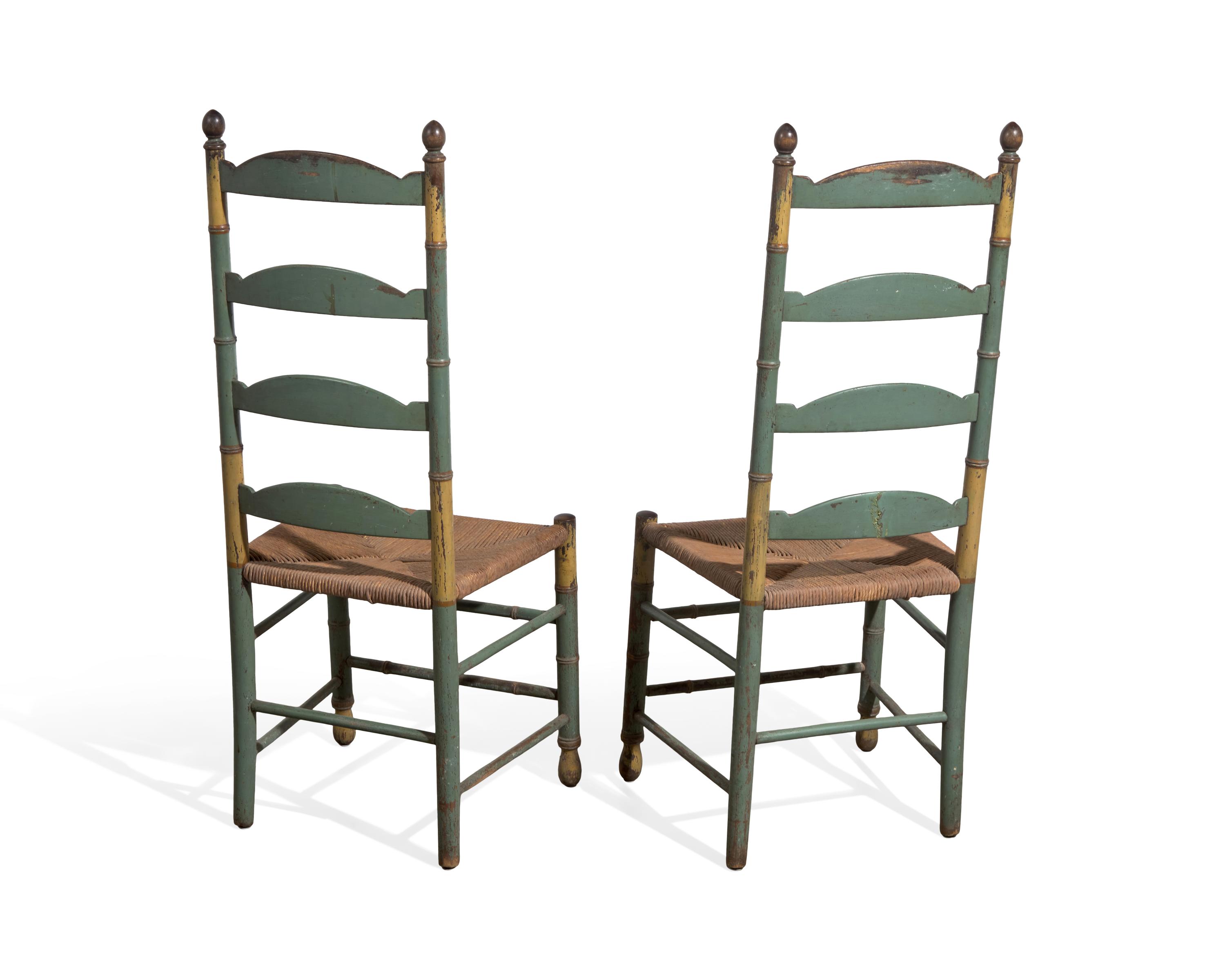 A Pair of Green-Painted and Decorated Ladder-Back Rush-Seat Side Chairs