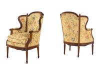 A Pair of Louis XVI Style Carved Walnut Bergères