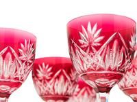 A Set of Ten Cranberry Cut-to-Clear Glass Wine Stems