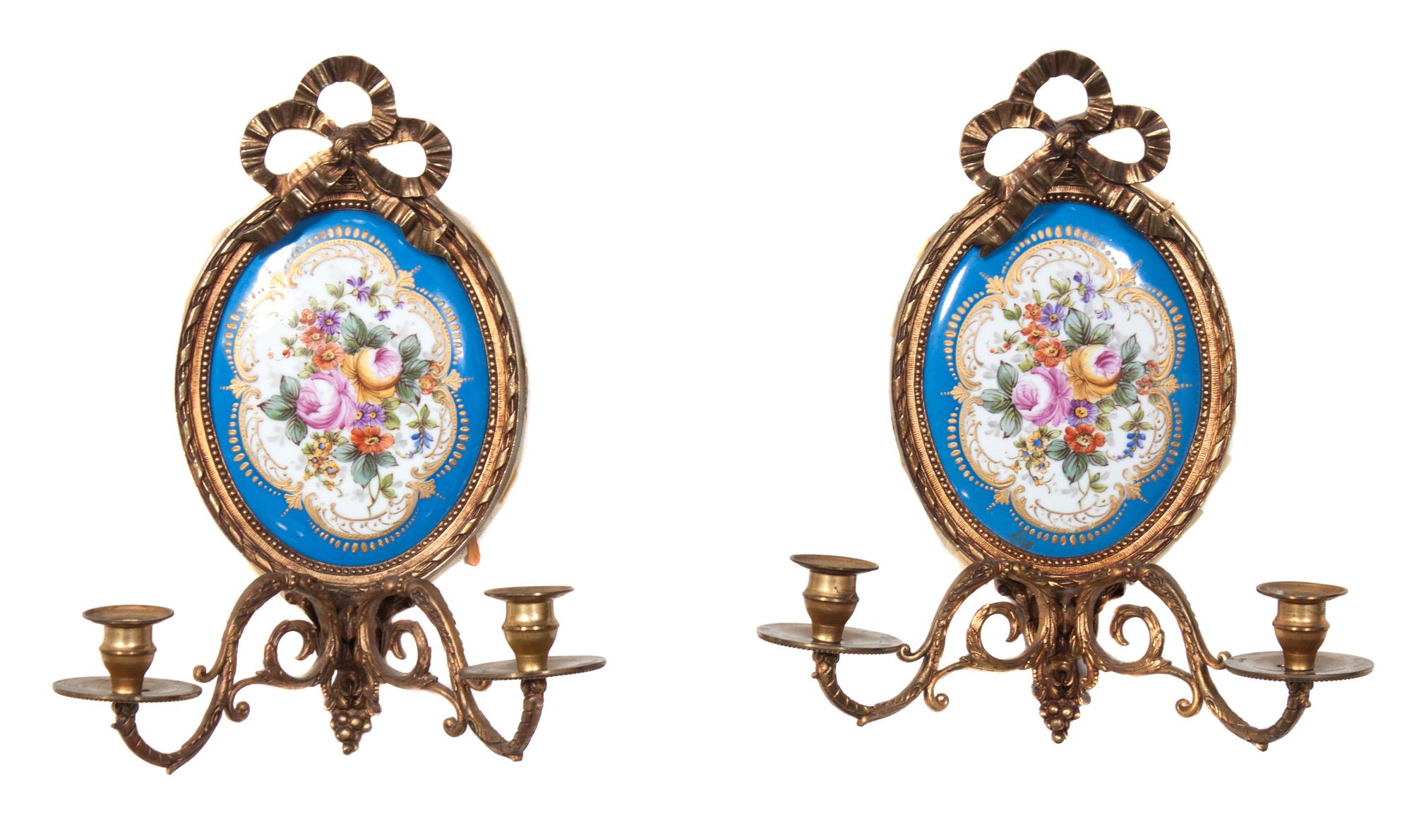 A Pair of Sevres Style Porcelain Mounted Gilt Bronze Two-Light Sconces Height 14 1/2 inches. — EARLY 20TH CENTURY