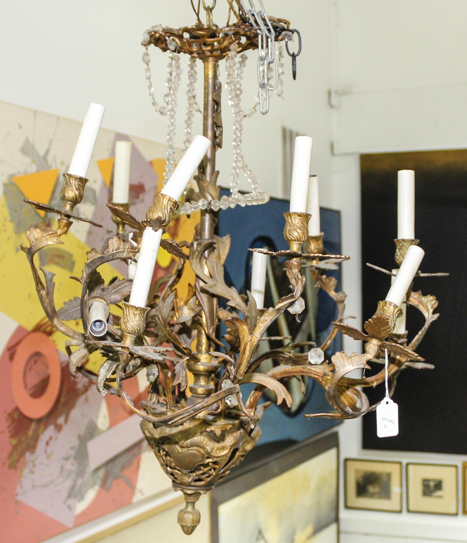 A Cast Metal Eight-Light Chandelier Height 26 inches.
