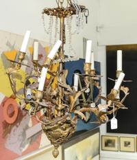 A Cast Metal Eight-Light Chandelier Height 26 inches.