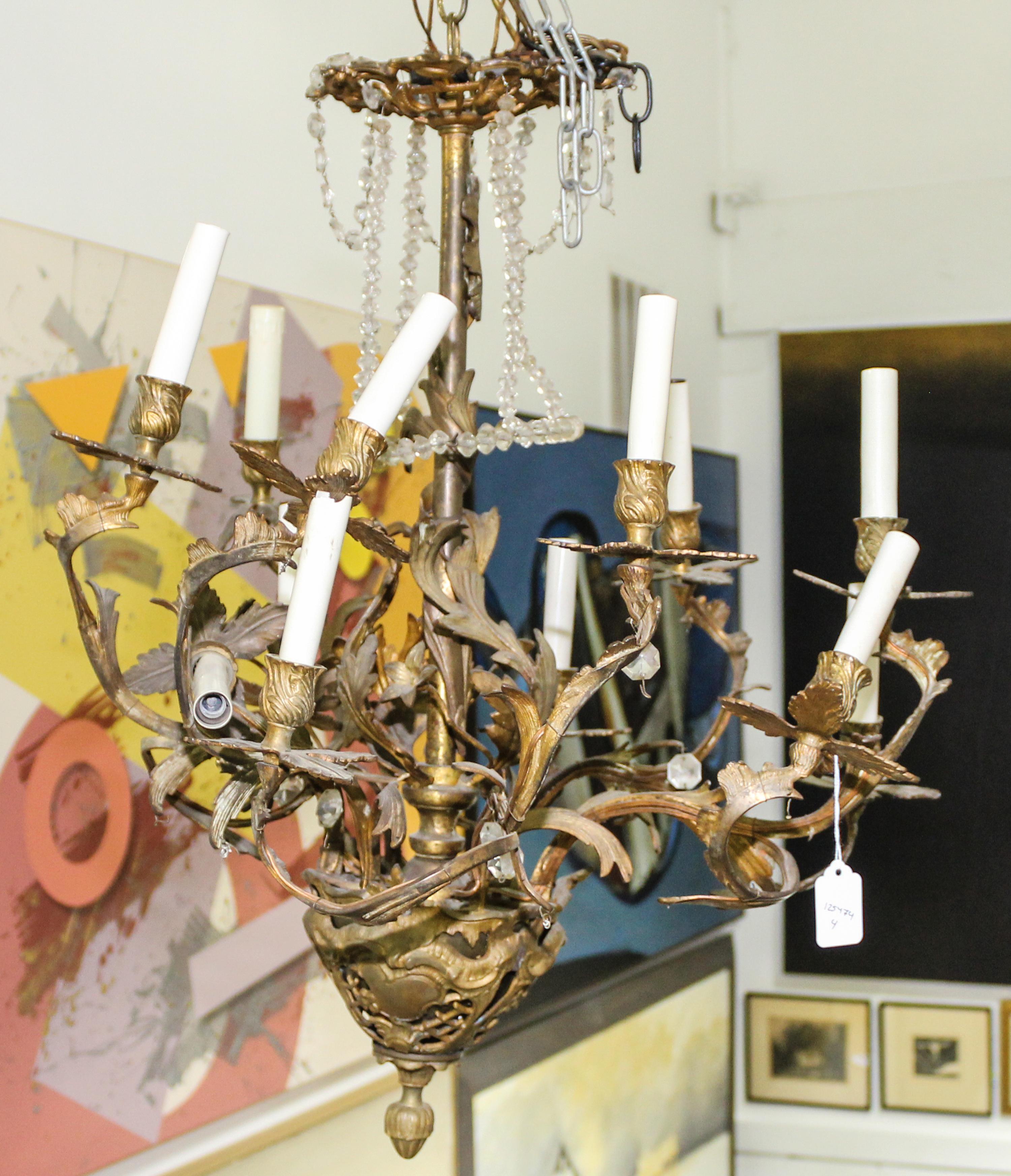 A Cast Metal Eight-Light Chandelier Height 26 inches.