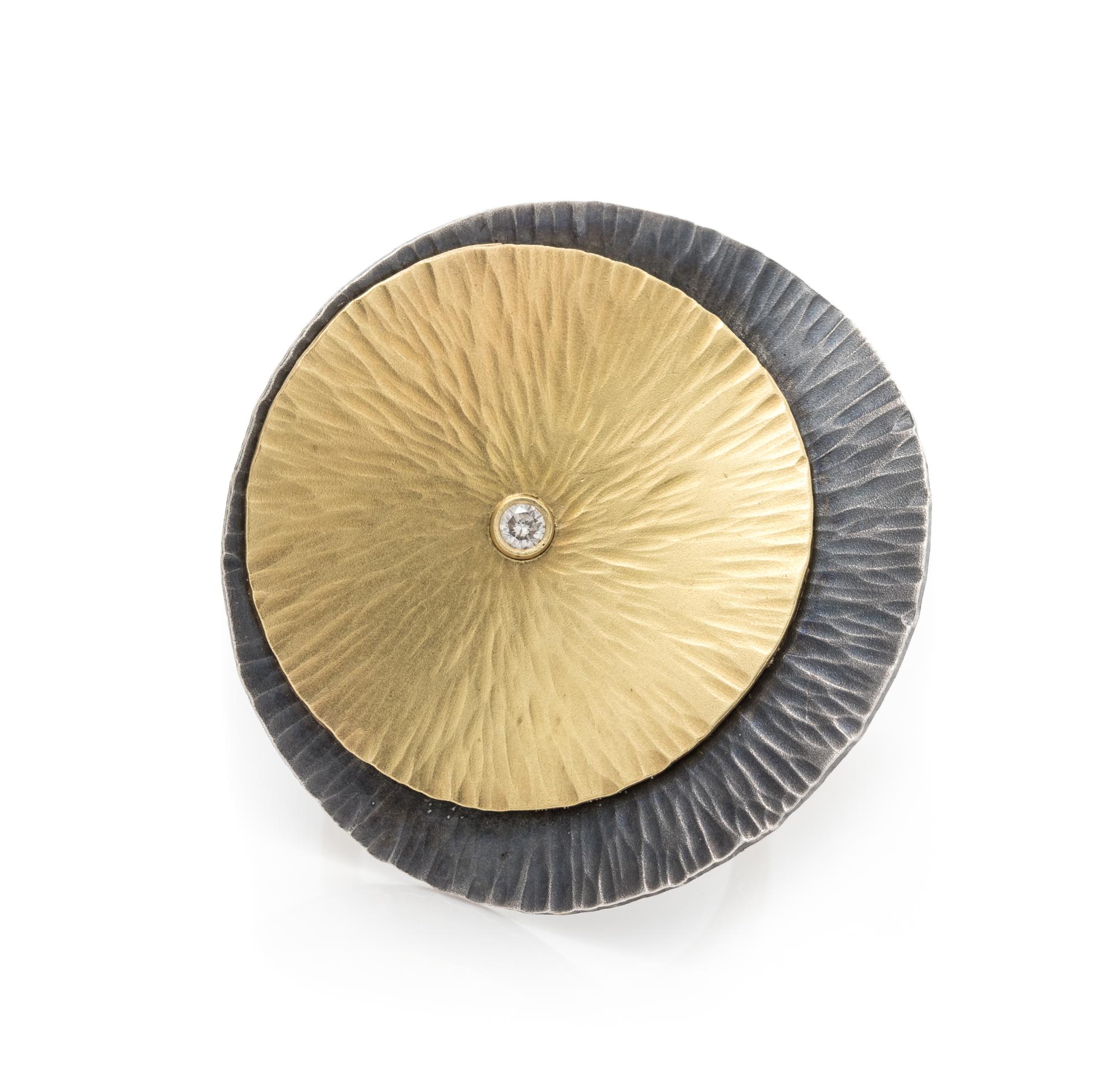 An Oxidized Silver, 18 Karat Yellow Gold and Diamond Ring, 8.95 dwts.