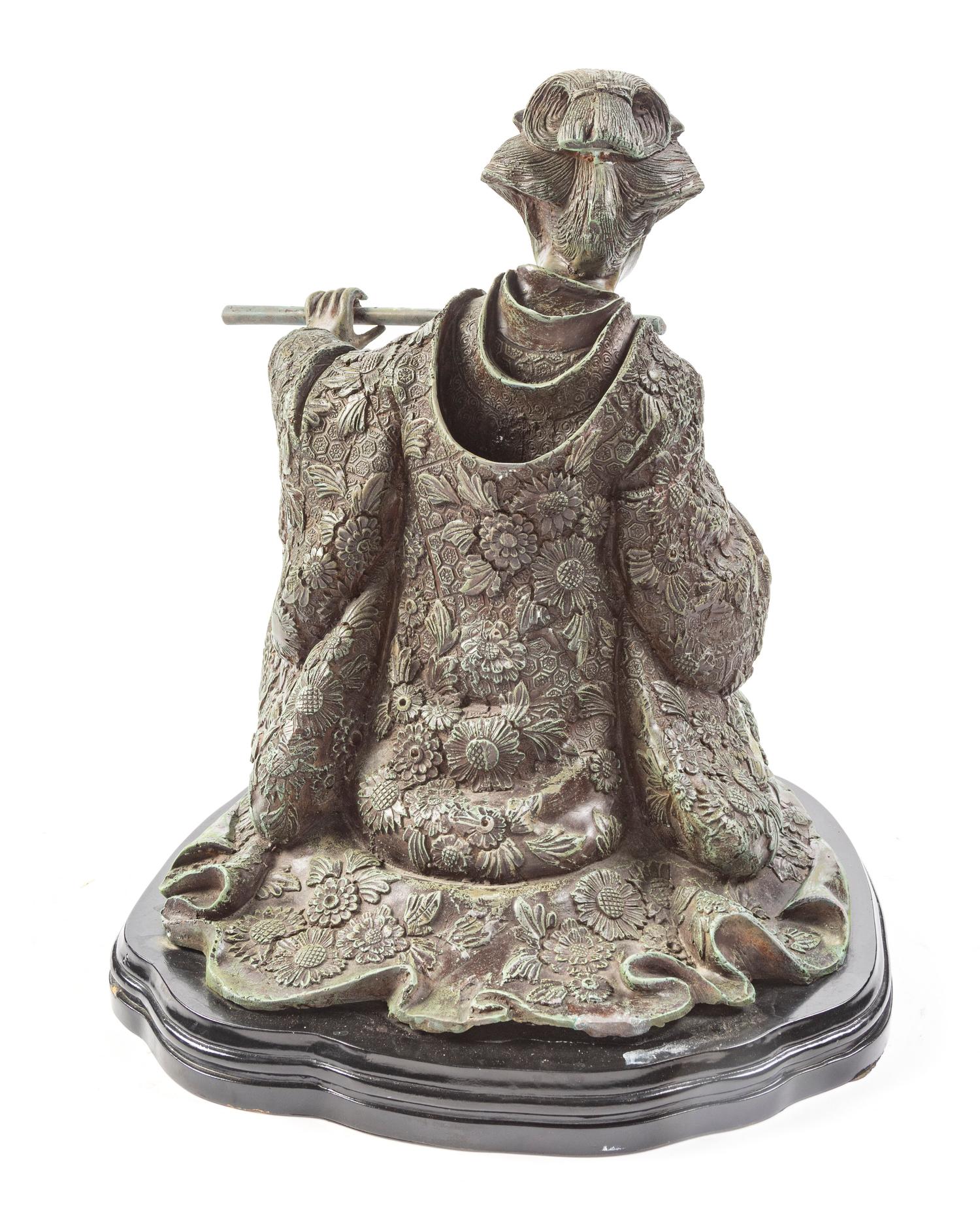 A Japanese Bronze Figure of a Woman Playing the Flute