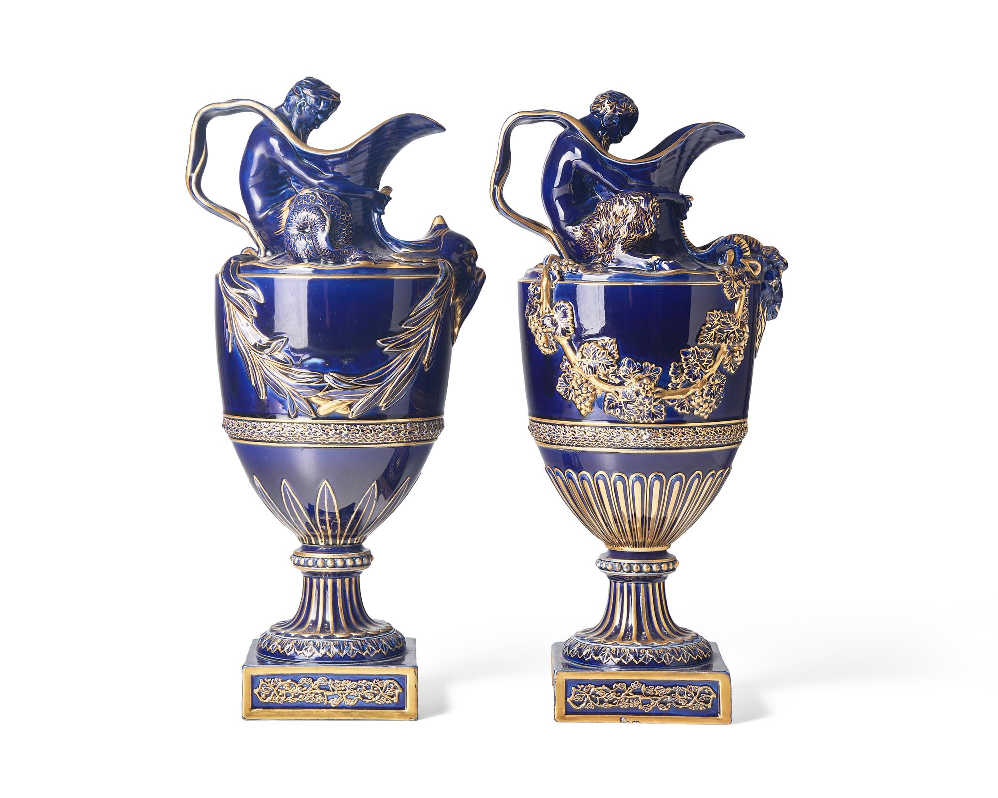 A Pair of Wedgwood Parcel Gilt Cobalt Glazed Ewers