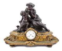 A Napoleon III Gilt and Patinated Bronze Figural Mantel Clock Width 25 inches.