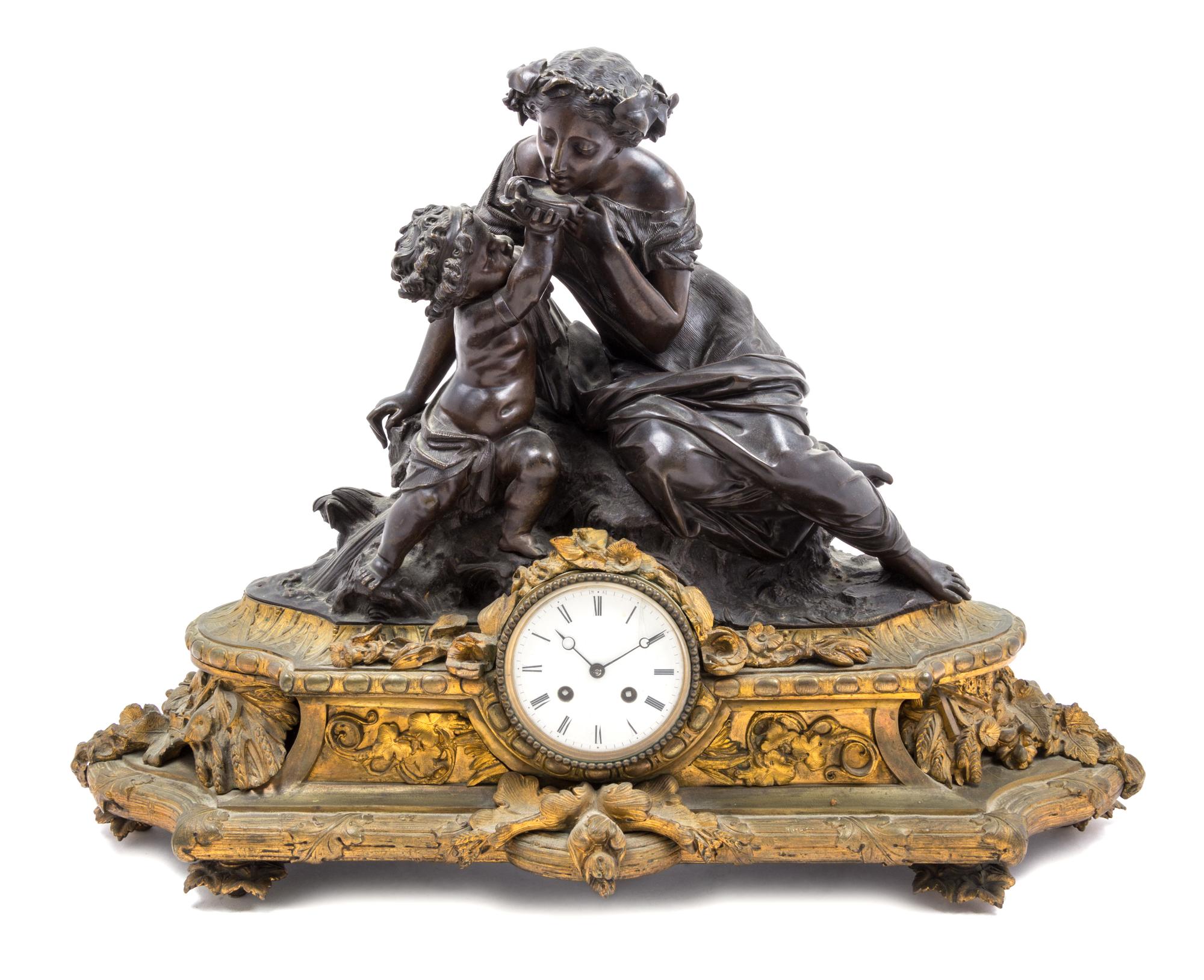 A Napoleon III Gilt and Patinated Bronze Figural Mantel Clock Width 25 inches.