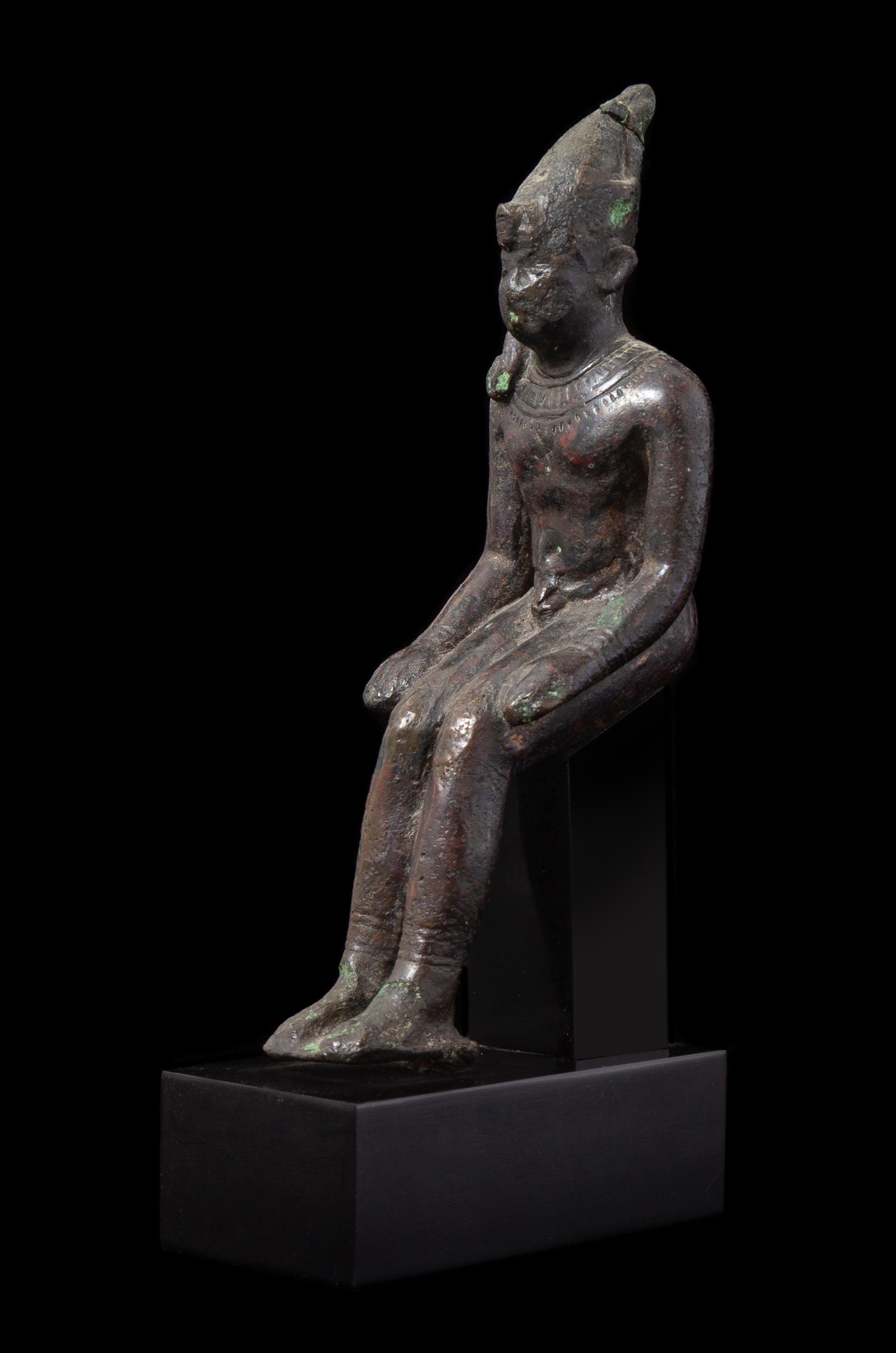 An Egyptian Bronze Seated Harpokrates Height 4 1/4 inches. — LATE PERIOD, DYNASTY 26-30, 664-343 B.C.E.